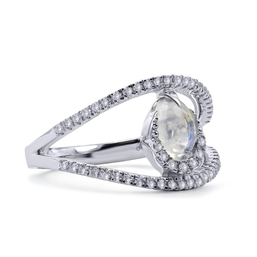 Crafted in 18kt white gold, this ring features an oval shaped 0.85 ct. moonstone that is set between a double shank design. The piece is adorned with 0.27 ct. of pavé set white diamonds.

Ring size is 7.0 (17.3 mm) and can be sized. 