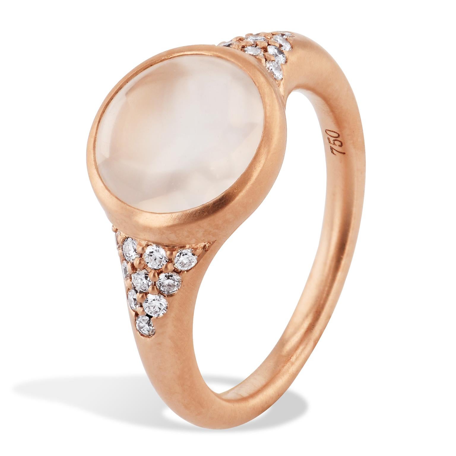 No need to look outside to see the moon. With this ring you will have it always on your fingers. Admire this cabochon cut Moonstone bezel set in a satin finished rose gold ring with pave-set diamonds, and never worry about a cloudy sky to spoil your