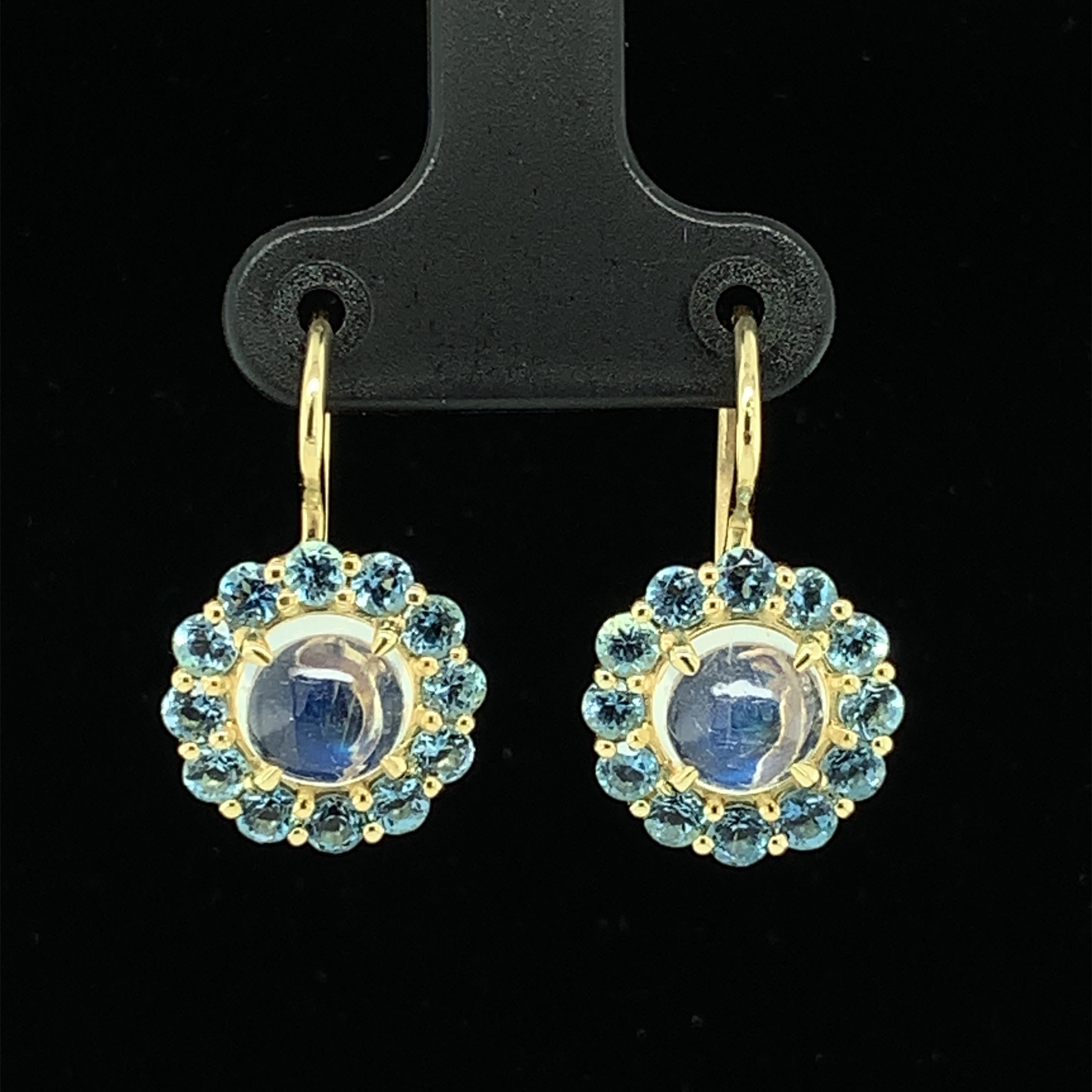 These 18k yellow gold handmade drop earrings feature lovely “blue flash” moonstones and Santa Maria Mine aquamarines. Santa Maria aquamarines are in a class by themselves - prized for their rare and striking depth of color. These earrings are the