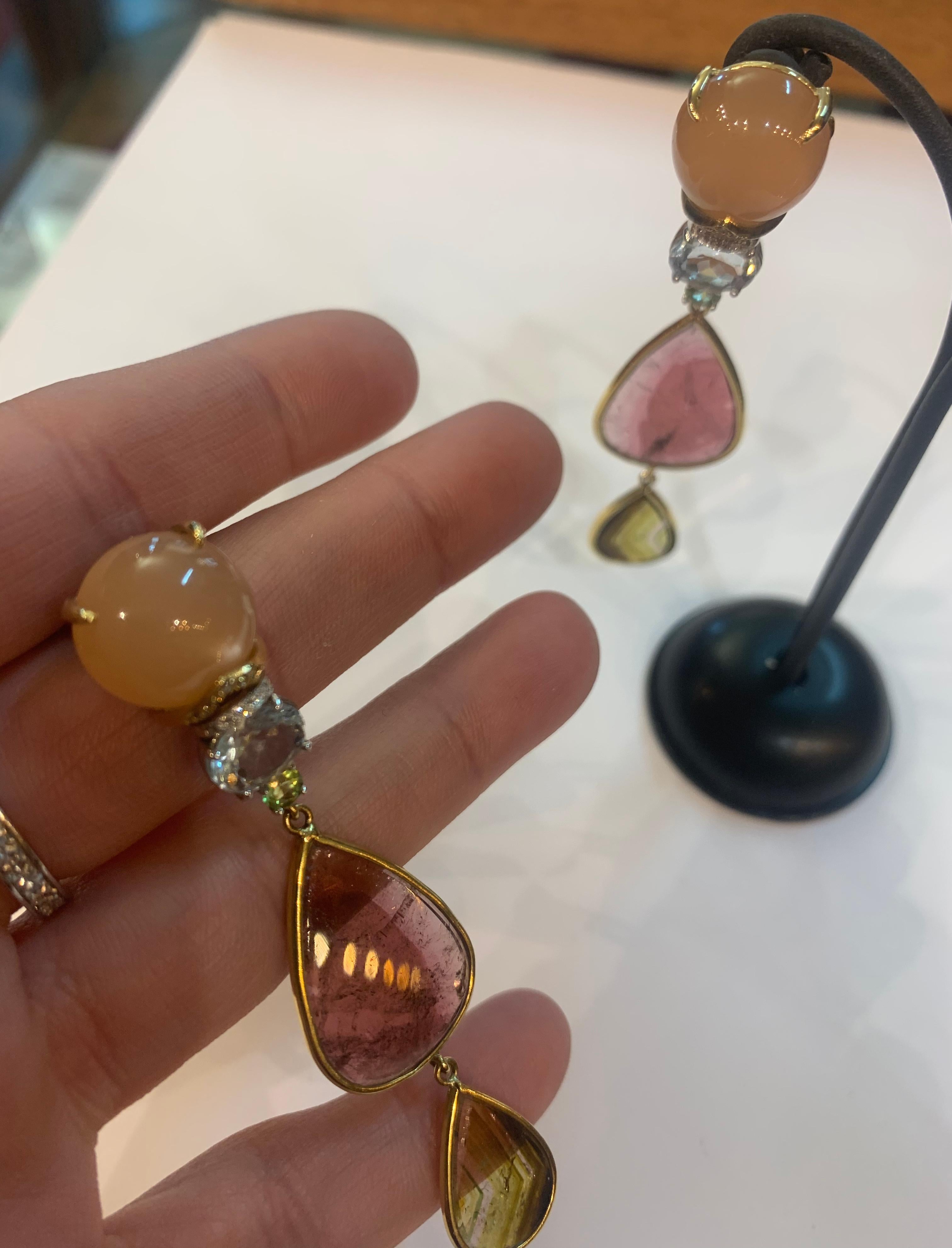 - Handmade in our 150 year old workshop South of Rome, Italy
- Cabochon cut Moonstones
- Faceted Oval Aquamarines
- Brilliant cut Peridots
- Handcut Pear drop Tourmalines
- 18k Yellow Gold (10gr)
- with 0,20ct White VS-G Diamonds

Wow! These are one