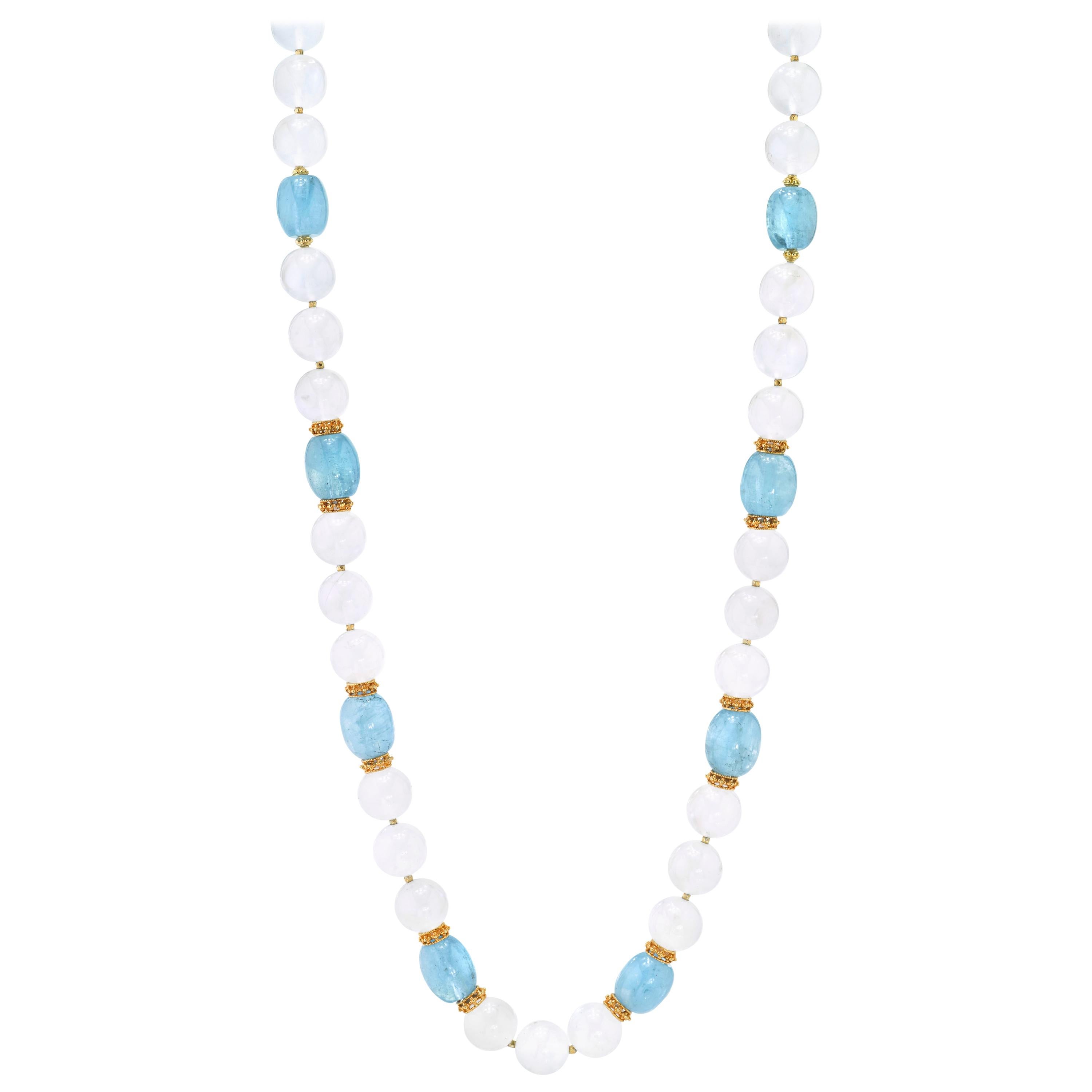 Soft aquamarine blue and dreamy iridescent moonstone gemstone beads come together to create this extraordinarily beautiful necklace! Measuring 24 inches in length, this strand features 10 impressive, barrel-shaped aquamarine beads and 33 exquisite,