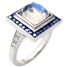 Anello con pietra di luna, zaffiro blu e diamante con montatura in oro bianco 18 carati