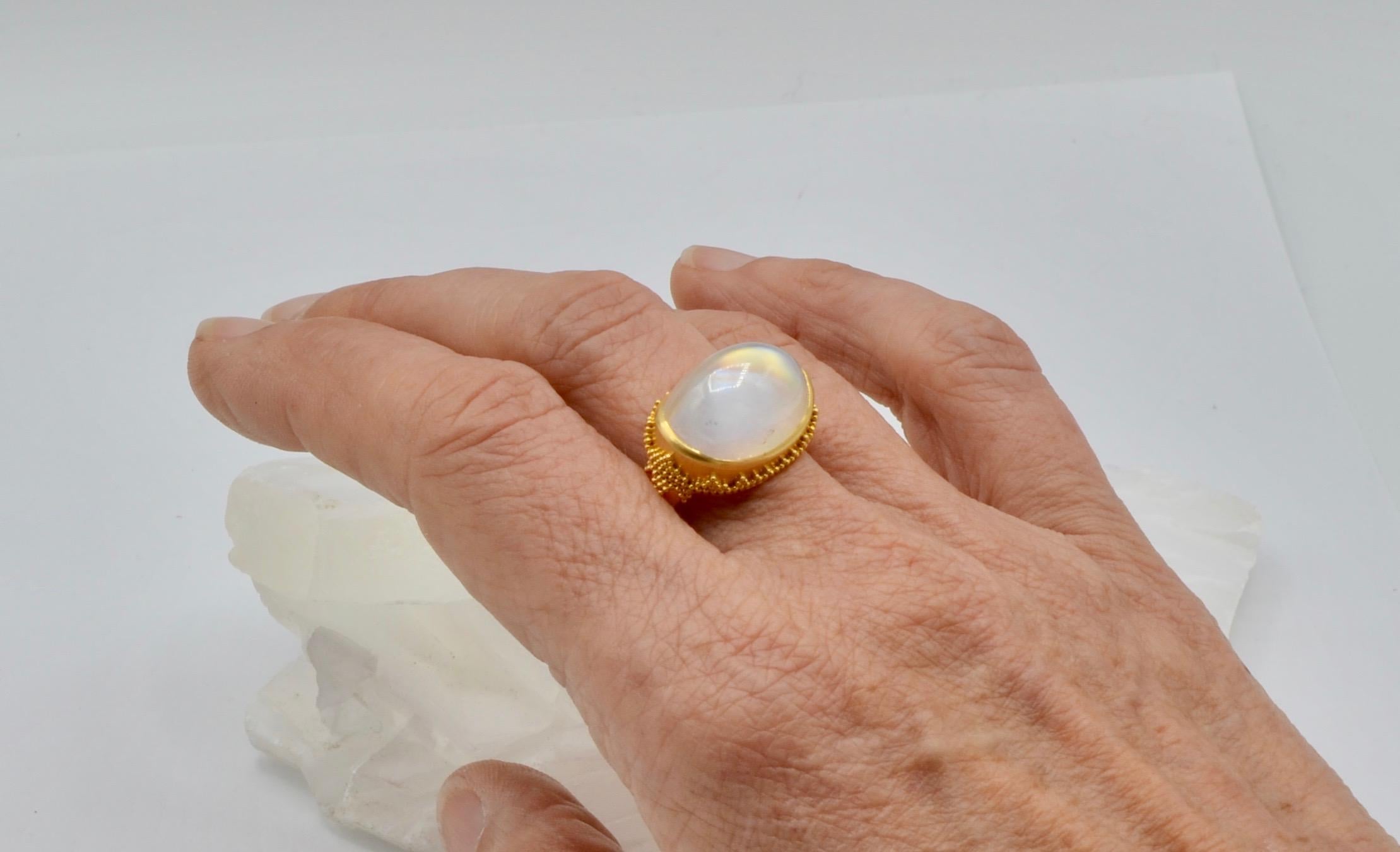 This  Steven Battelle  designed moonstone ring is reminiscent of the Aroura Borealis. It has a mesmerizing rainbow effect as you move. To see it is to really appreciate the depth and energy. The 21.2 carat moonstone is set in 22 karat gold with