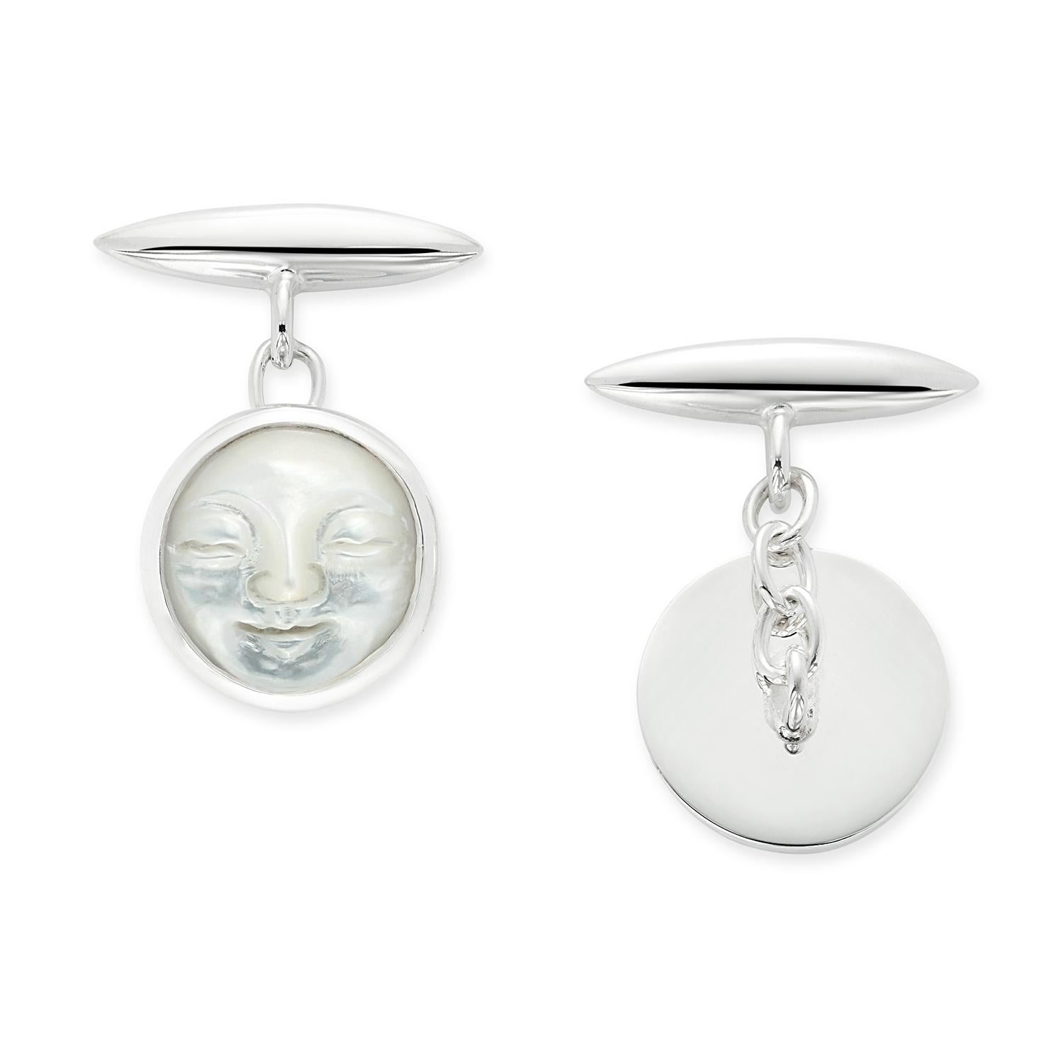 A unique pair of carved, mother of pearl, moon face cufflinks. Set in sterling silver with chain links. Perfect for weddings and special occasions. Hand made in London by master craftsmen. These hand carved round moon faces will add style to any