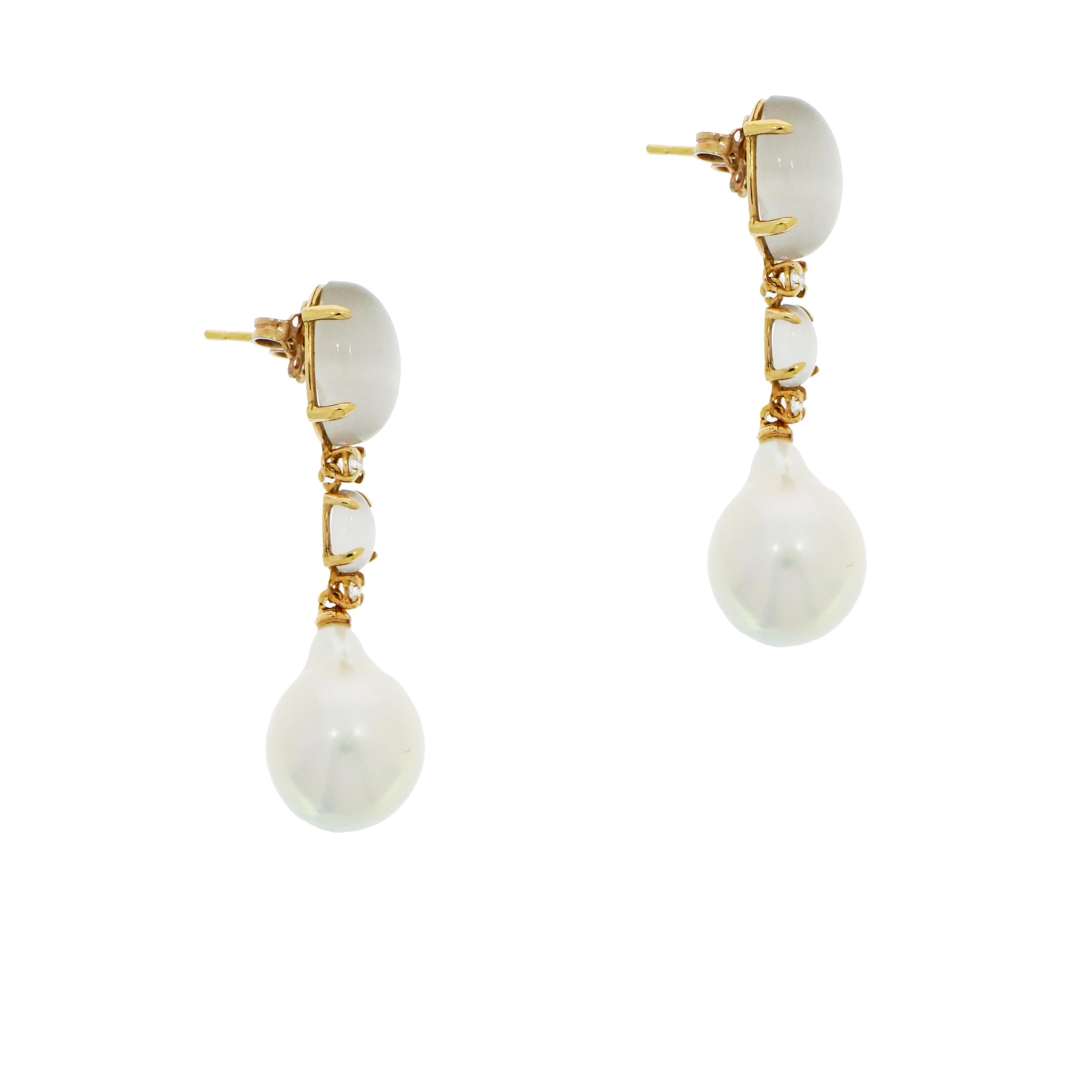 This delicately feminine moonstone, diamond and baroque pearl drop earrings accented with round diamonds are certain to become a timeless accessory.
This drop earrings measures approximately 1.75 inch long and the grayish moonstone 14 x 10mm with