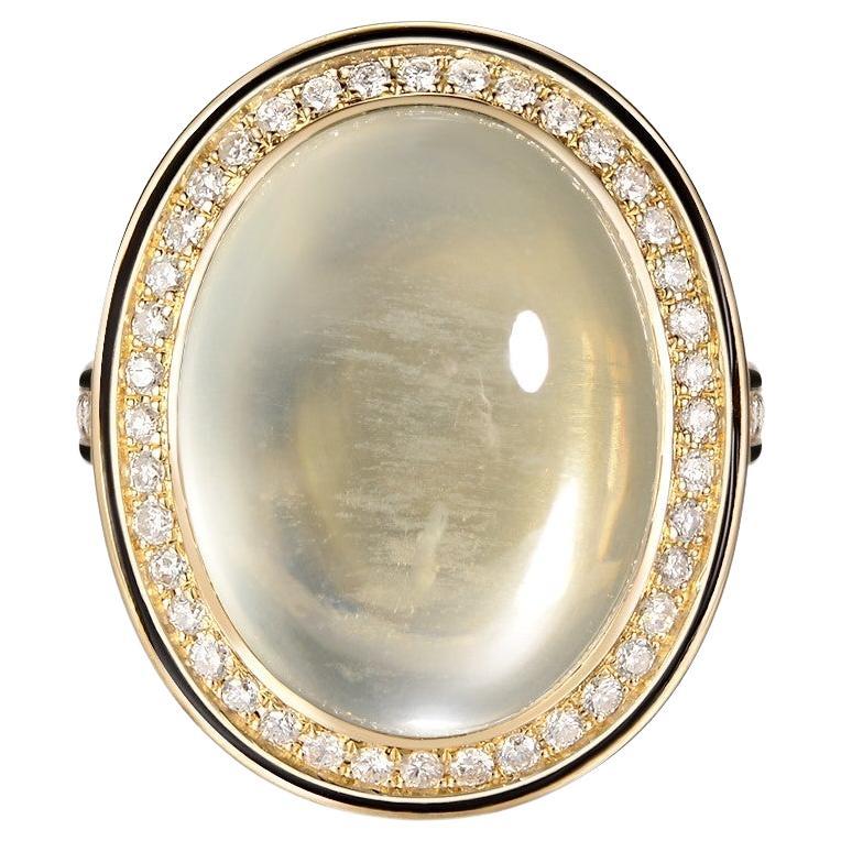 This ring features a 18.24 carats oval cabochon moonstone, moonstone is set in bezel setting; moonstone is surrounded by a diamond halo and black enamel outside the diamond halo. Ring is set in 14 karat yellow gold.

US 6.5
Resizing is