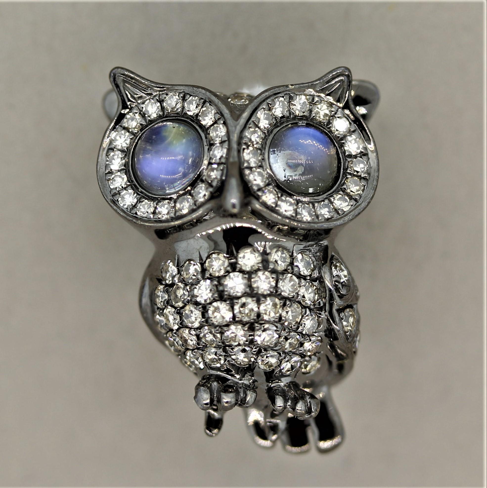 A cute little owl ready to come along on your next outfit. The little guy measures close to an inch long and is covered in 0.67 carats of round brilliant cut diamonds. It has 2 big eyes which are made of moonstones weighing 0.54 carats. Made in 18k