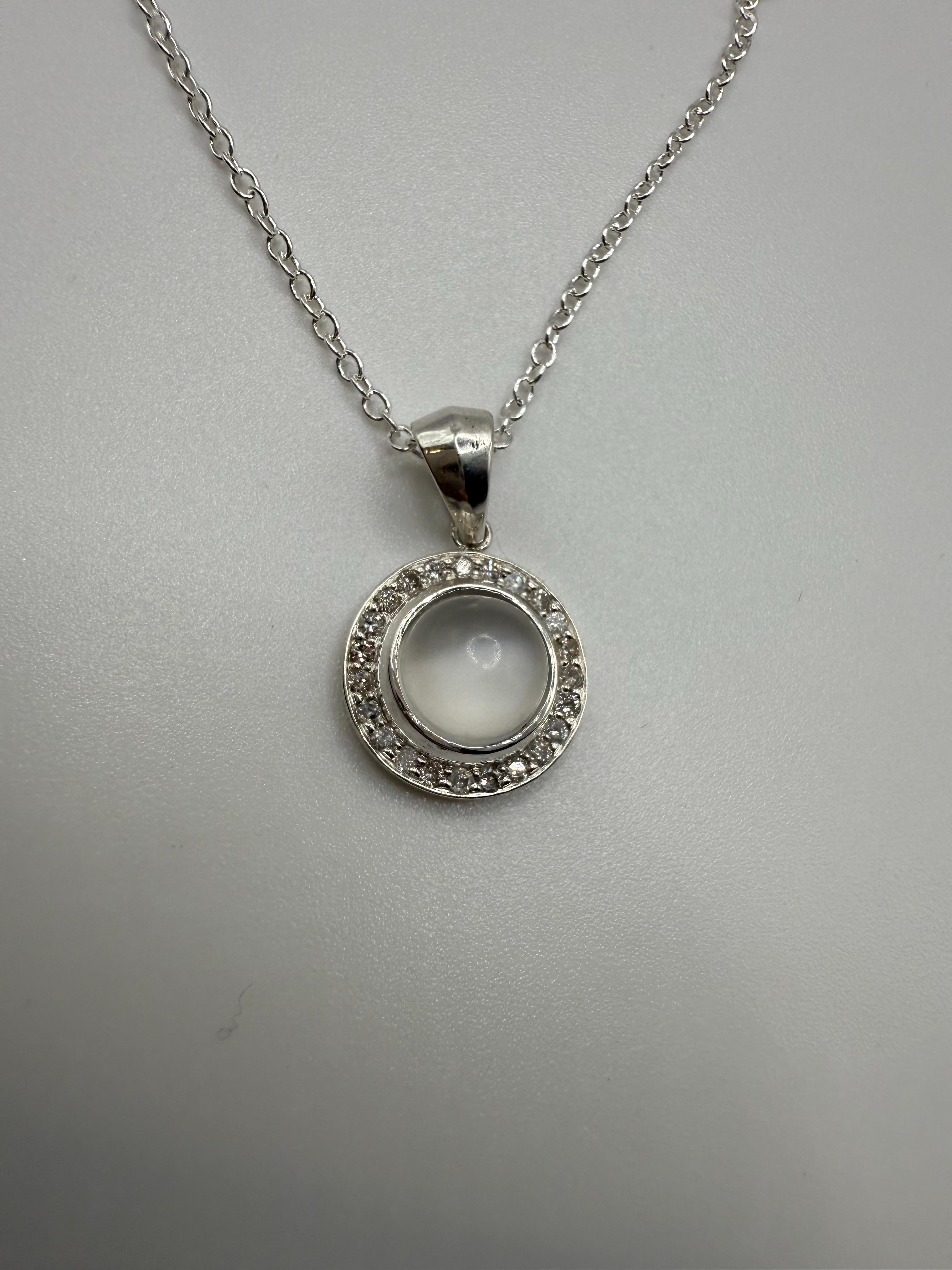 This pendant is really hard to take photos with because the moonstone has this shimmer and depth that most cameras cannot capture, its very elegant and the diamonds are so sparkly and alive, all diamonds equal 0.45 carats and are Si clarity and H-I