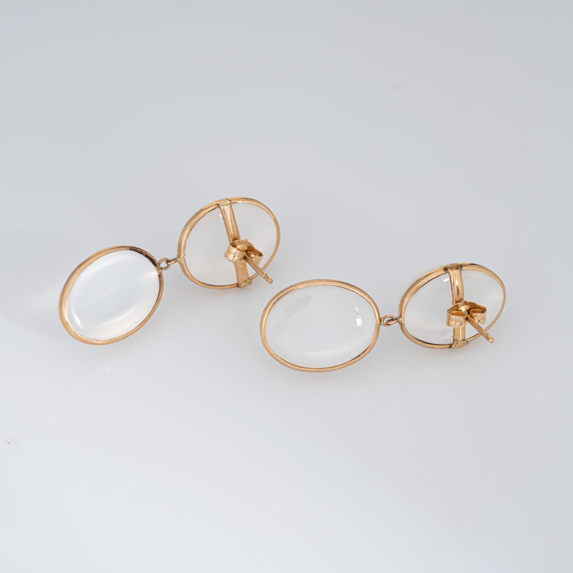 Elegant pair of moonstone drop earrings crafted in 14k yellow gold. 

Cabochon cut moonstone is estimated at 8 carats each and total an estimated 32 carats. The moonstones are in very good condition and free of cracks or chips.
The stylish earrings