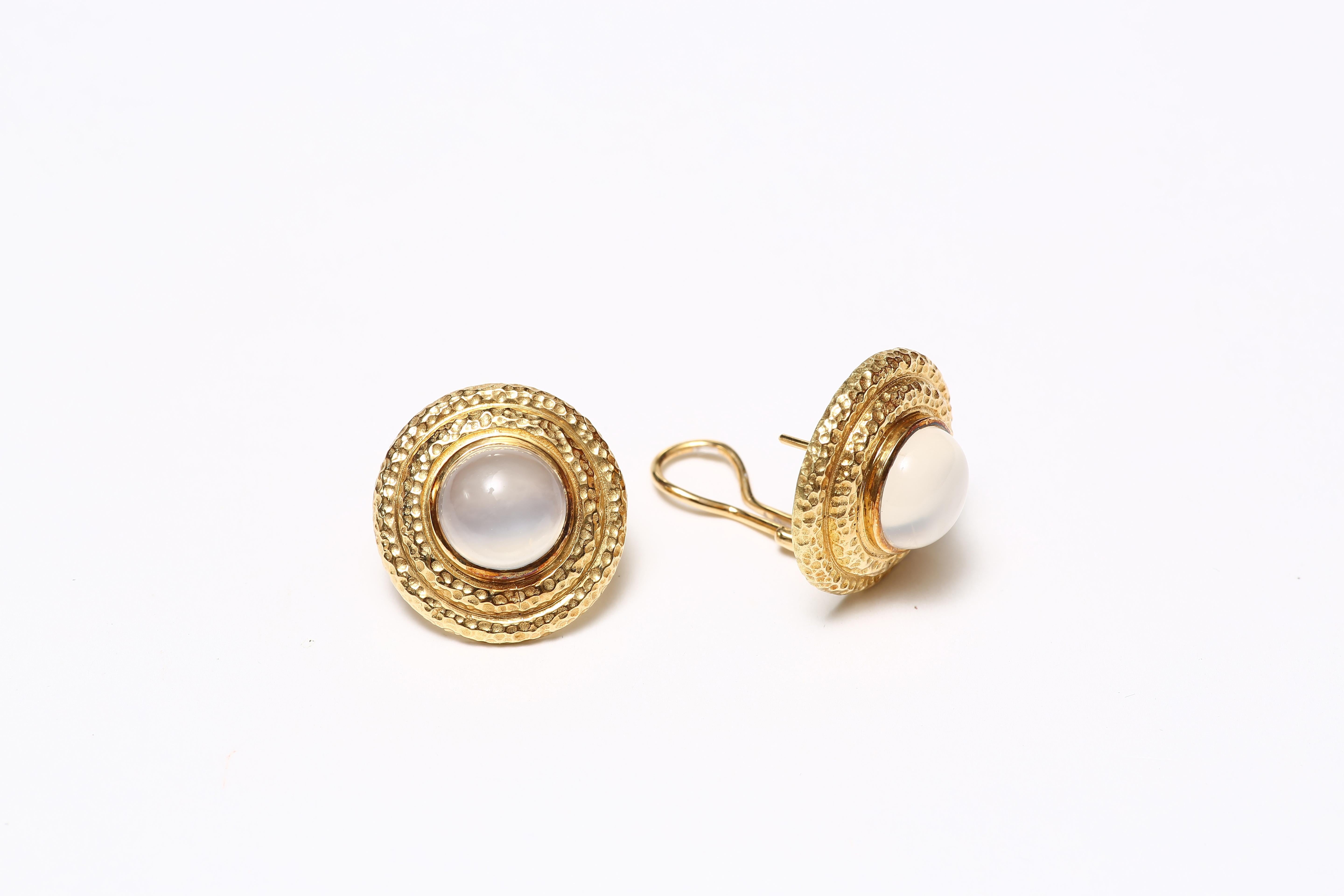 The earrings with round cabochon moonstones set in hand-hammered 18K gold stepped frames. The back posts & clips in solid 18 karat gold.

Designed by AMANDA CLARK for Altfield, our collection focuses on natures most lovely materials such as pearls,