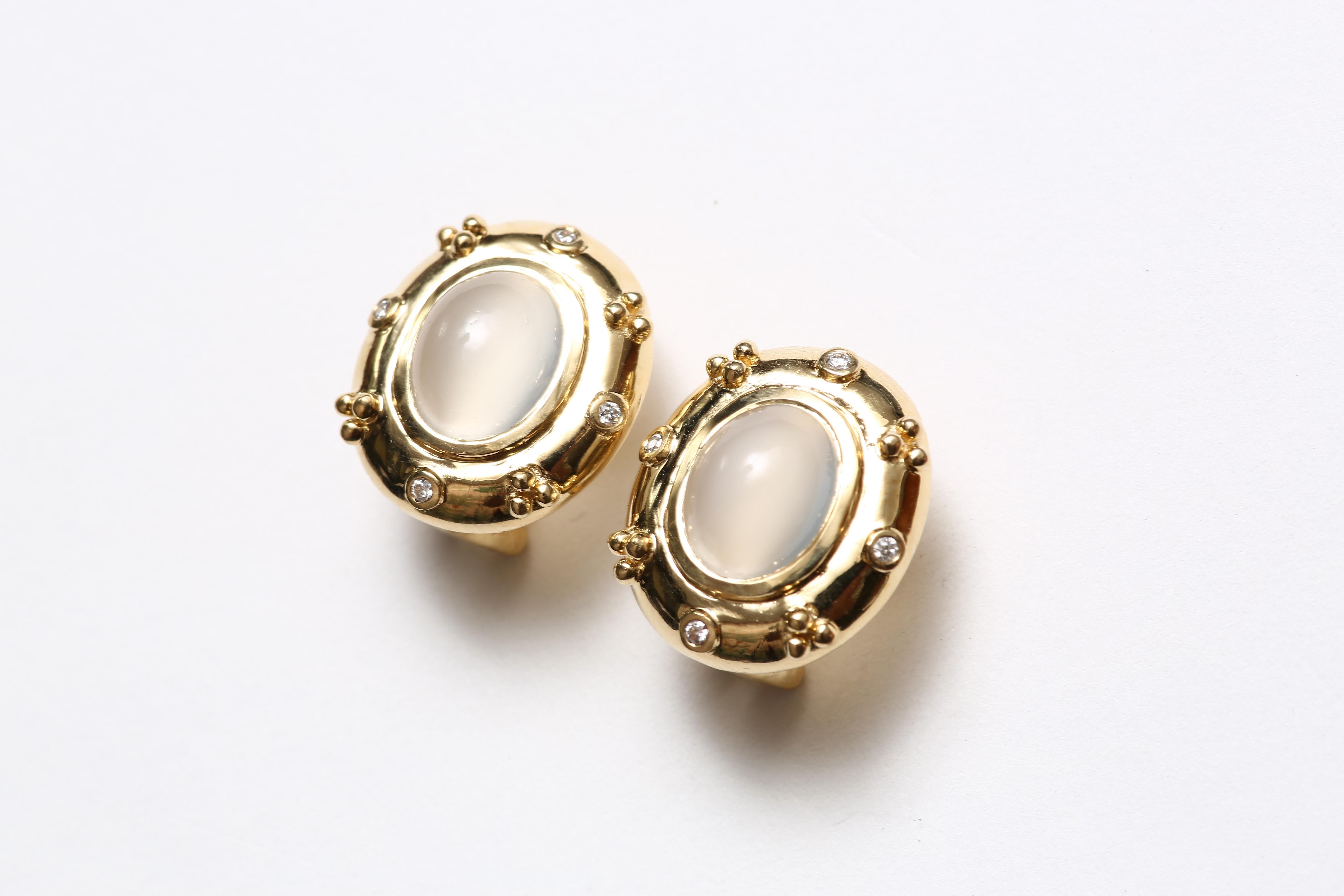 A lovely pair of earrings in solid 18 K gold decorated with small diamonds inset around oval cabachon moonstones. 

Designed by AMANDA CLARK for Altfield, our collection focuses on natures most lovely materials such as pearls, amber, turquoise,