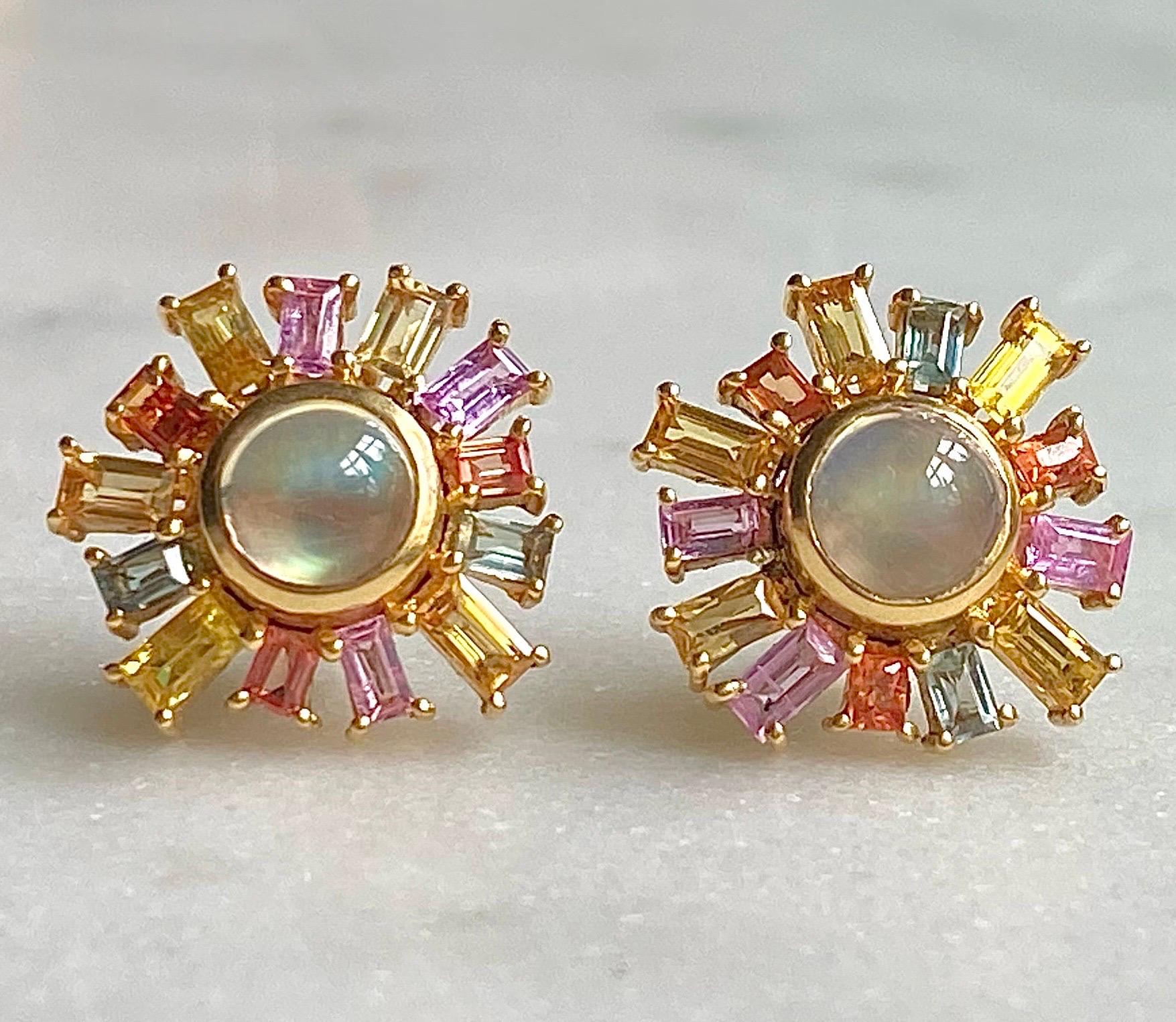 These rainbow moonstone and multicolored sapphire studs are designed by award winning jewelry designer, Lauren Harper. These studs are set in warm 18kt matte Gold and are sure to get noticed. The rainbow moonstone center stones have an otherworldly