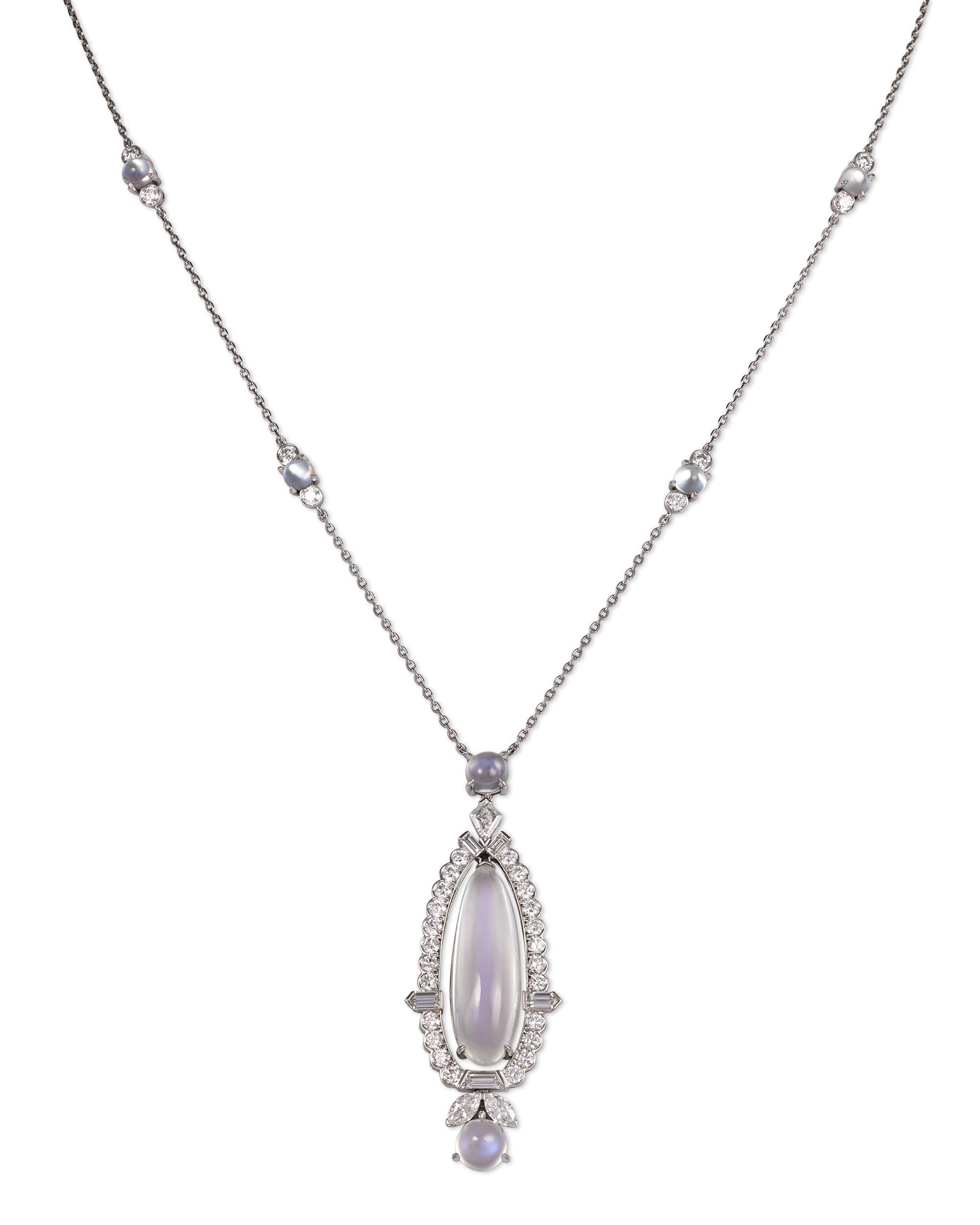 A luminous oval-shaped moonstone and several moonstone beads are the stars of this Raymond Yard pendant necklace. Moonstone is a type of gemstone-quality variety of feldspar that is known for its pearl-like schiller, or iridescent luster. These