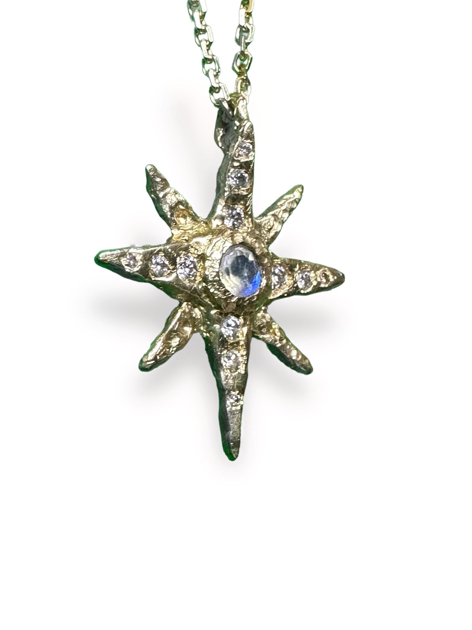 Indulge in the beauty and symbolism of the Northern Star with this stunning one-of-a-kind necklace. Crafted in 18K yellow gold, this necklace features a breathtaking rainbow moonstone at its center and adorned with sparkling diamonds, making it