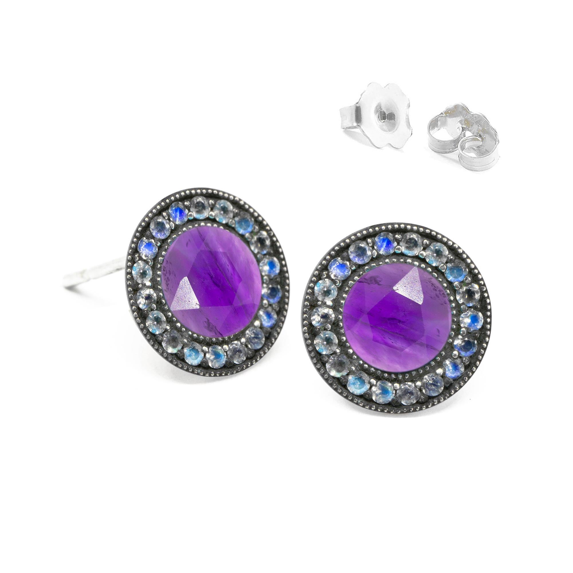In the Moonstone Orbit Oxidized Studs, concentric circles of engraved blackened silver and luminous moonstones surround amethyst stones for a cool mix of textures and lusters.

Nina Nguyen Design's patent-pending earrings have an element on the back