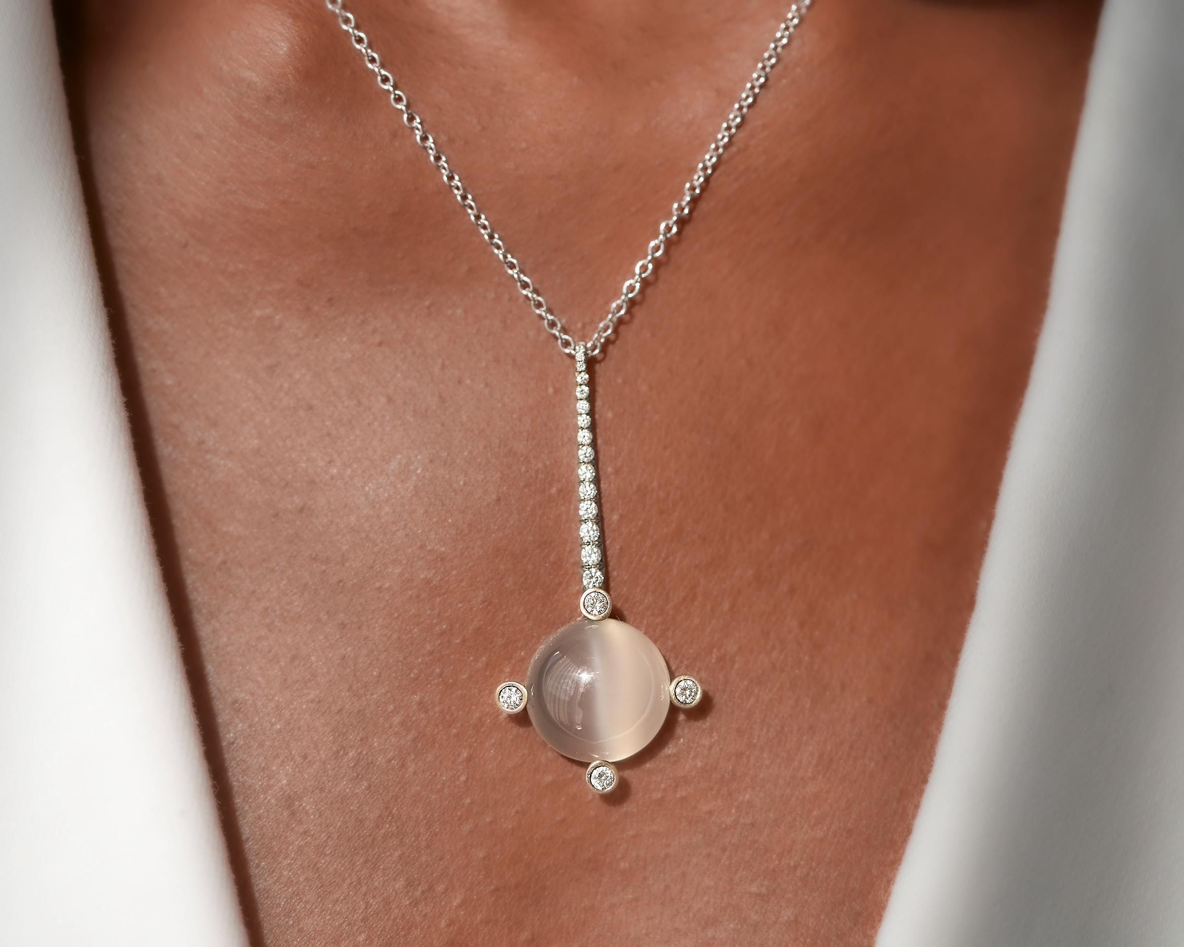 Selene was the Greek goddess of the moon, and the inspiration for this elegant pendant. 

Moonstone.
F/G diamonds, totaling approximately 0.45 carats.
18K white gold.
3/4