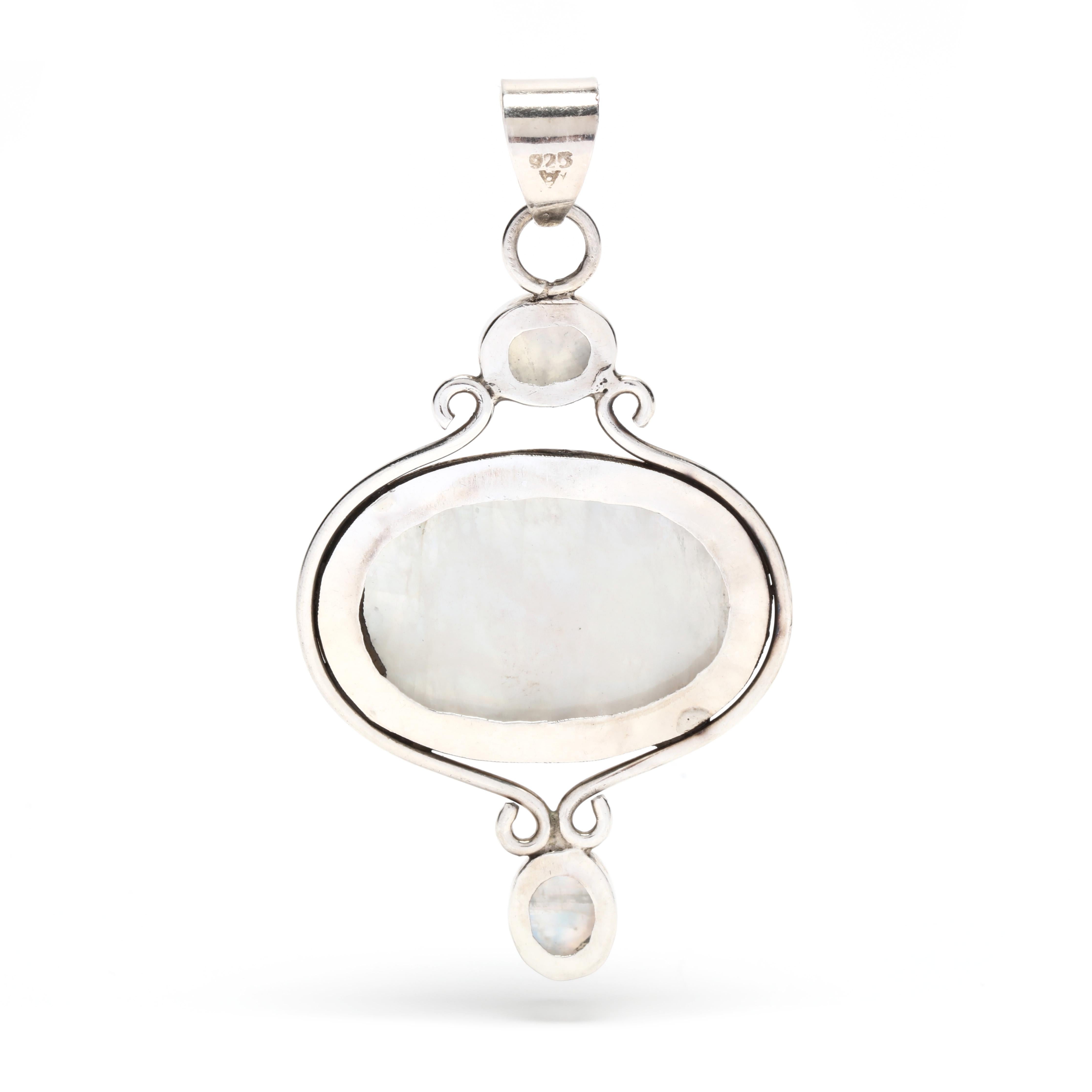 This stunning Moonstone Pendant is handmade from sterling silver and features a full moon design. The pendant measures 2 3/4 inches long and is sure to be a beautiful addition to any jewelry collection. The moonstone reflects the light from the
