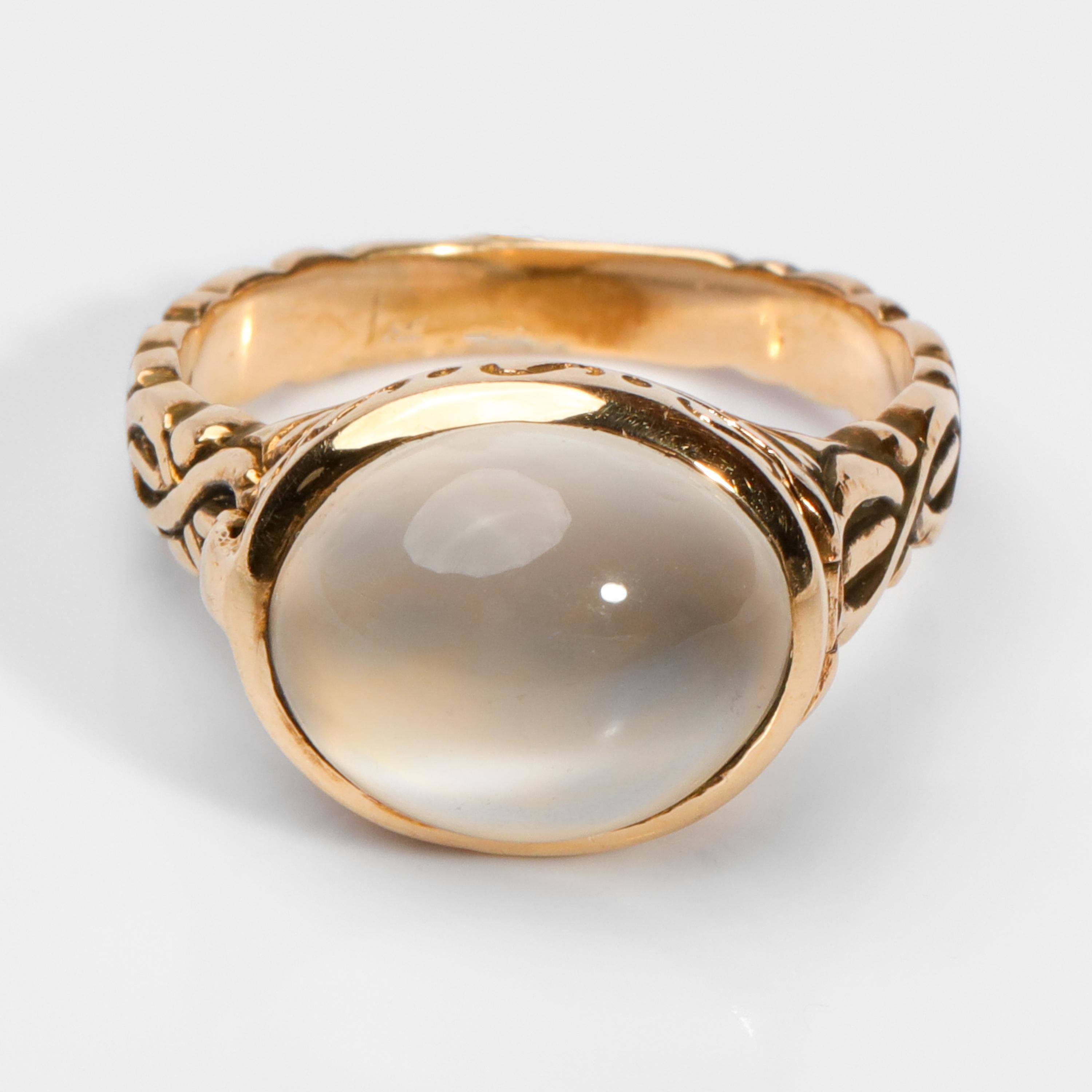 A moon-colored cat's eye moonstone displaying excellent chatoyancy (the sliding of the 