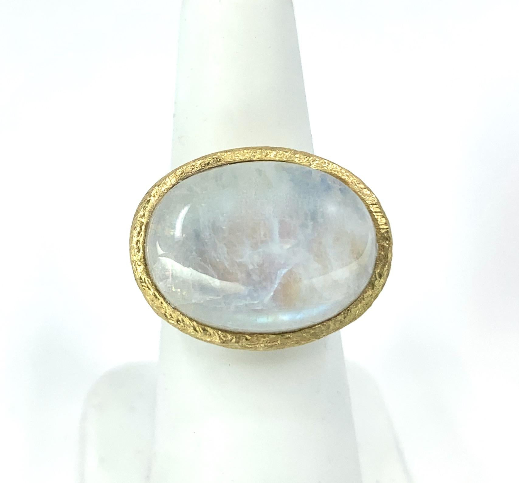 Eytan Brandes sculpted this modern, eye-catching bezel ring to display a 16 carat oval moonstone cabochon.  The stone has wonderful natural striations and almost opalescent luster, and it's perfectly set off by its neat surrounding ring of rich 18