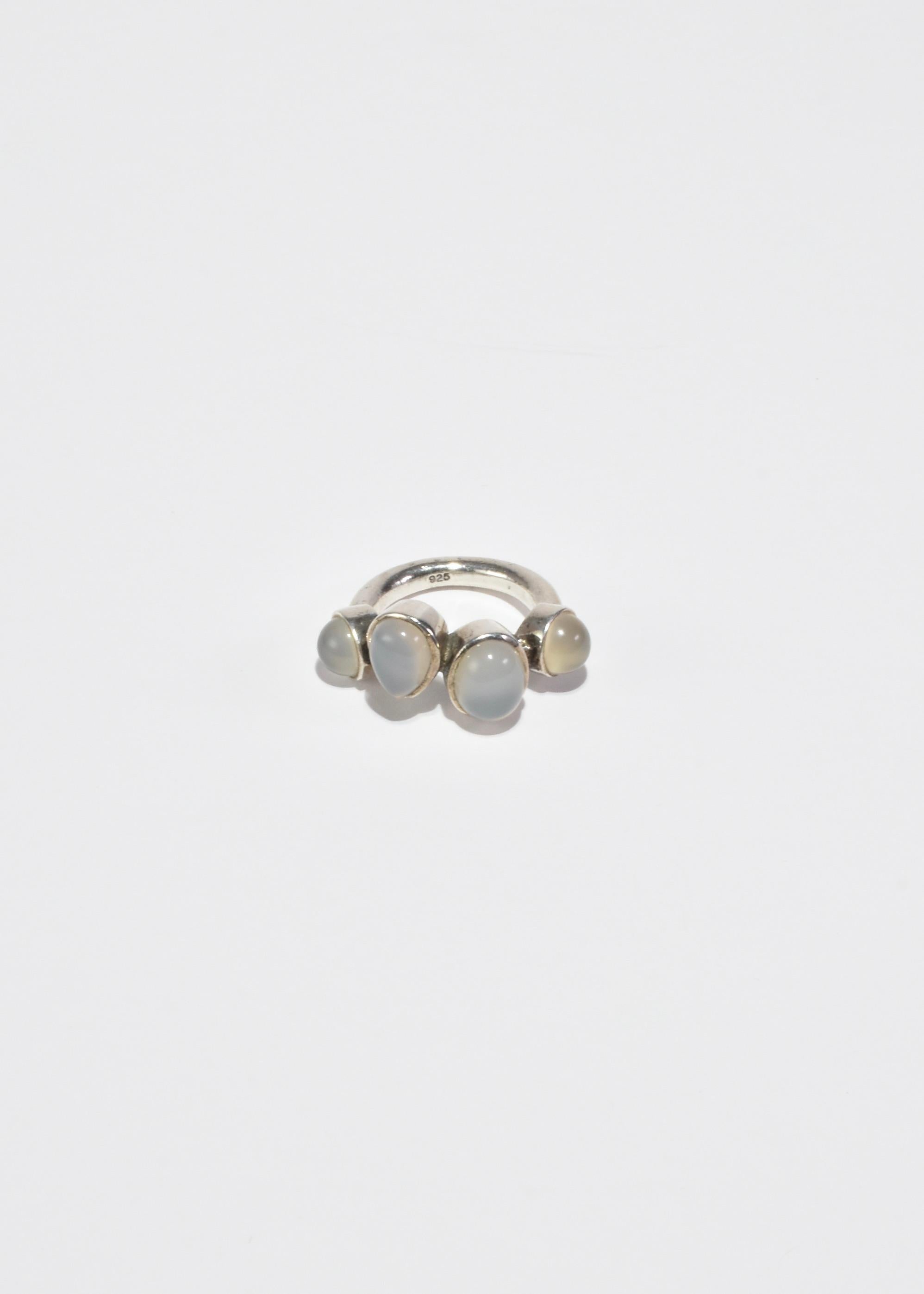 Stunning vintage silver ring with moonstone cabochons. Stamped 925.

Material: Sterling silver, moonstone.