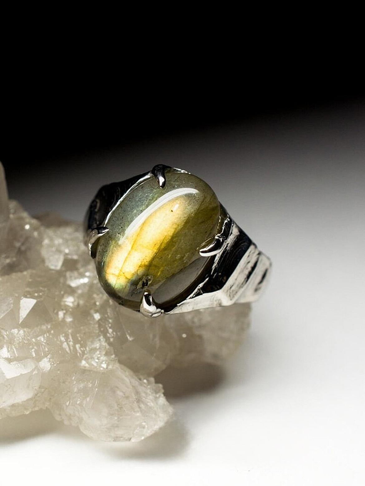 Sterling silver ring with natural Labrodarite Moonstone 
Labradorite origin - Madagascar
labrodarite measurements - 0.24 х 0.39 х 0.55 in / 6 х 10 х 14 mm
ring size - 7 US
ring weight - 5.5 grams