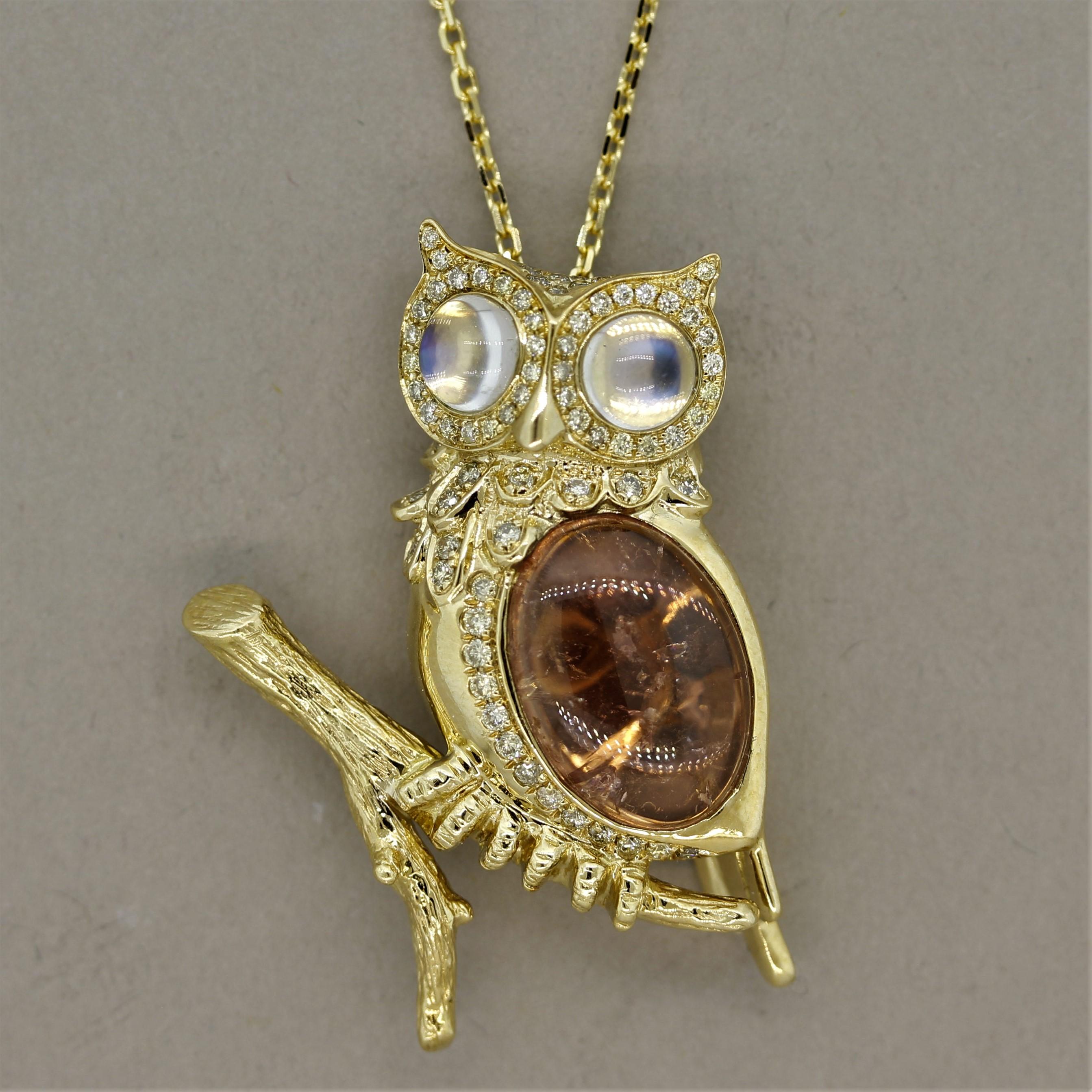 A cute and wise owl! This lovely pendant features a gold owl with 2 moonstone eyes weighing 0.83 carats. As light hits the moonstones a blue adularescence can be seen shining over the gems. The owl's body is made of a luscious 5.61 carat