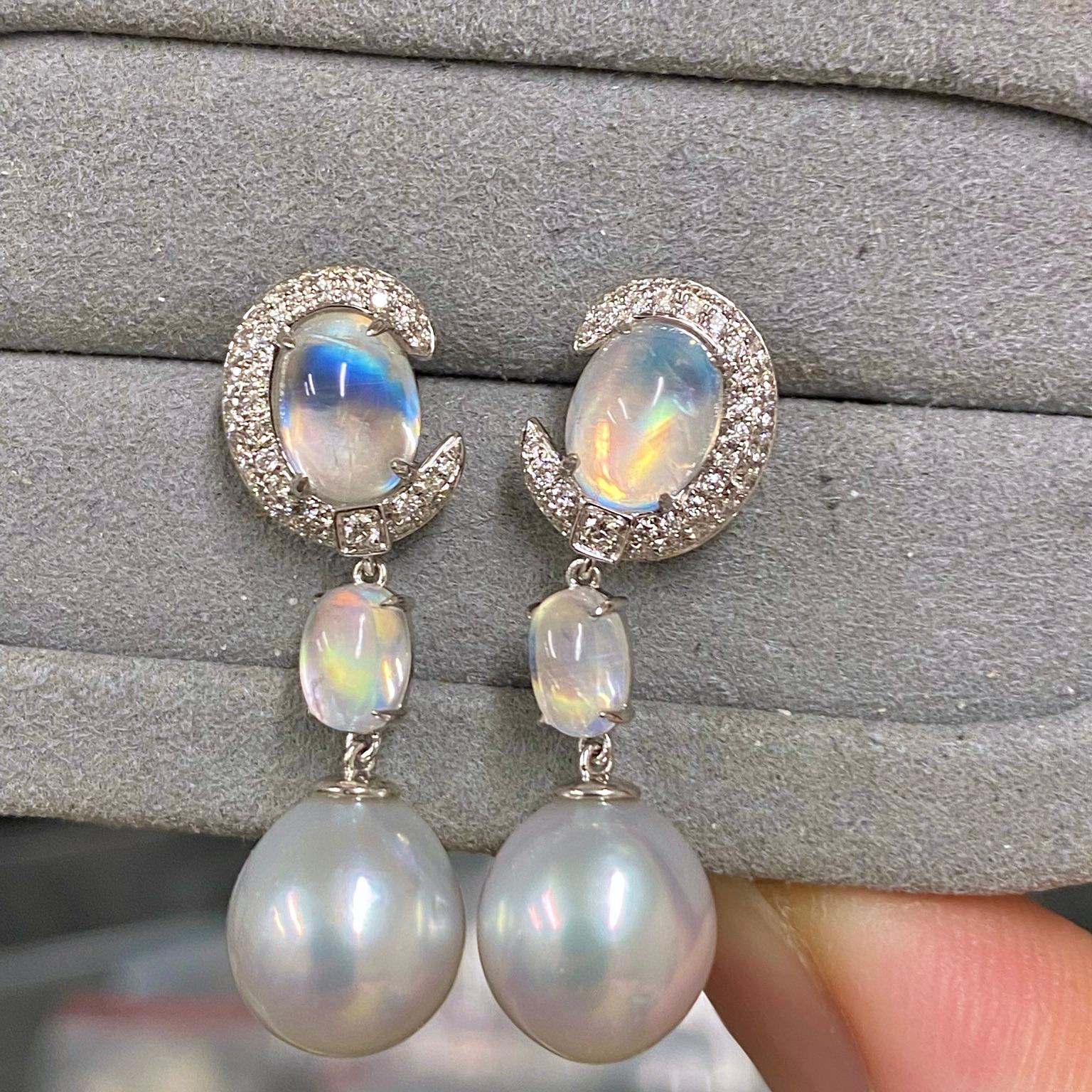 This earring in inspired by the Moonstones. The top part of the earring is a Moonstone engulfed by a Diamonds encrusted Moon Crescent followed by a Moonstone Cabochon and at the bottom dangling a White Australian South Sea Pearl. The base tone of