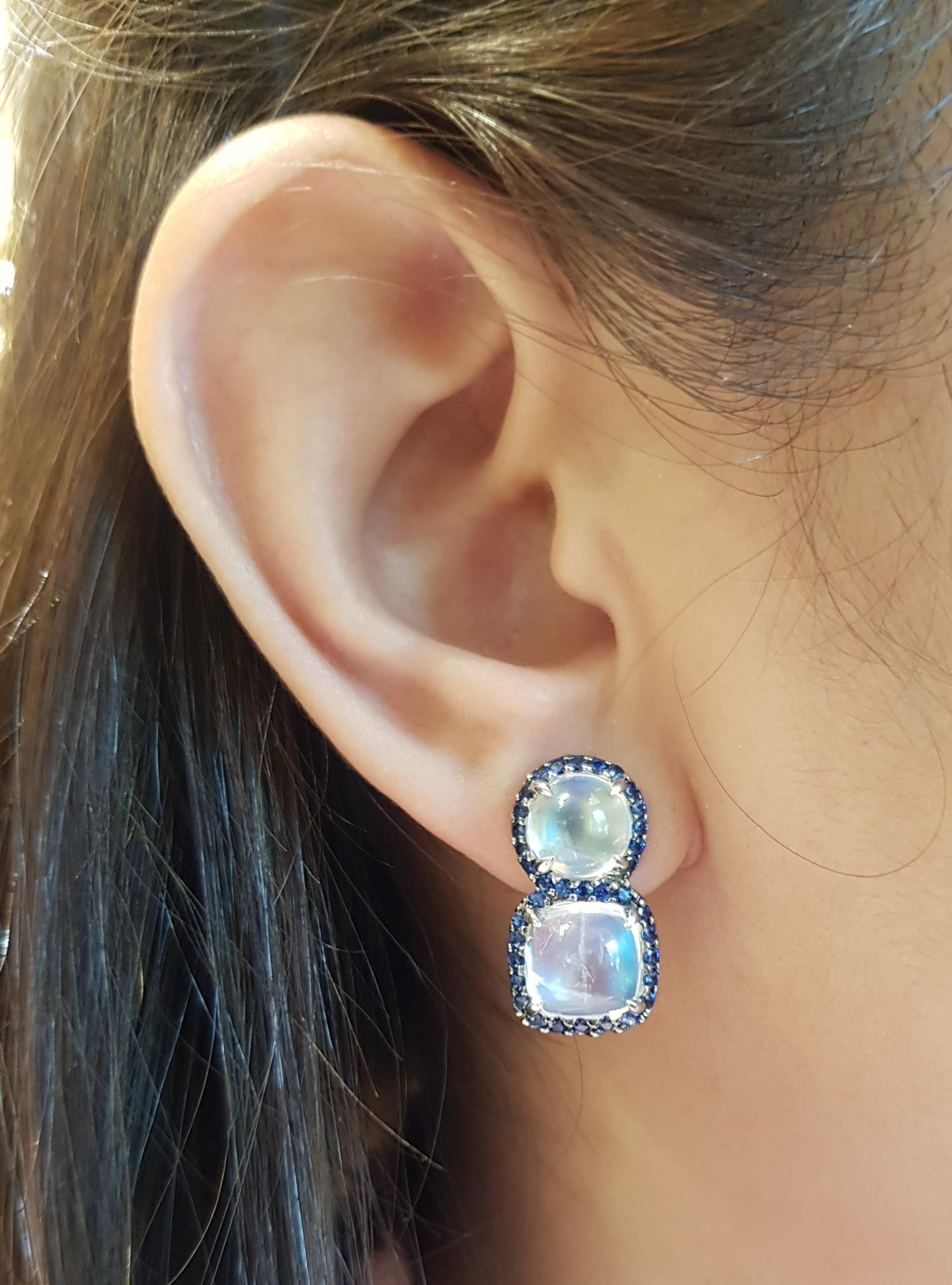 Moonstone 12.43 carats with Blue Sapphire 1.35 carats Earrings set in 18 Karat White Gold Settings

Width:  1.1 cm 
Length: 2.1 cm
Total Weight: 11.17 grams

