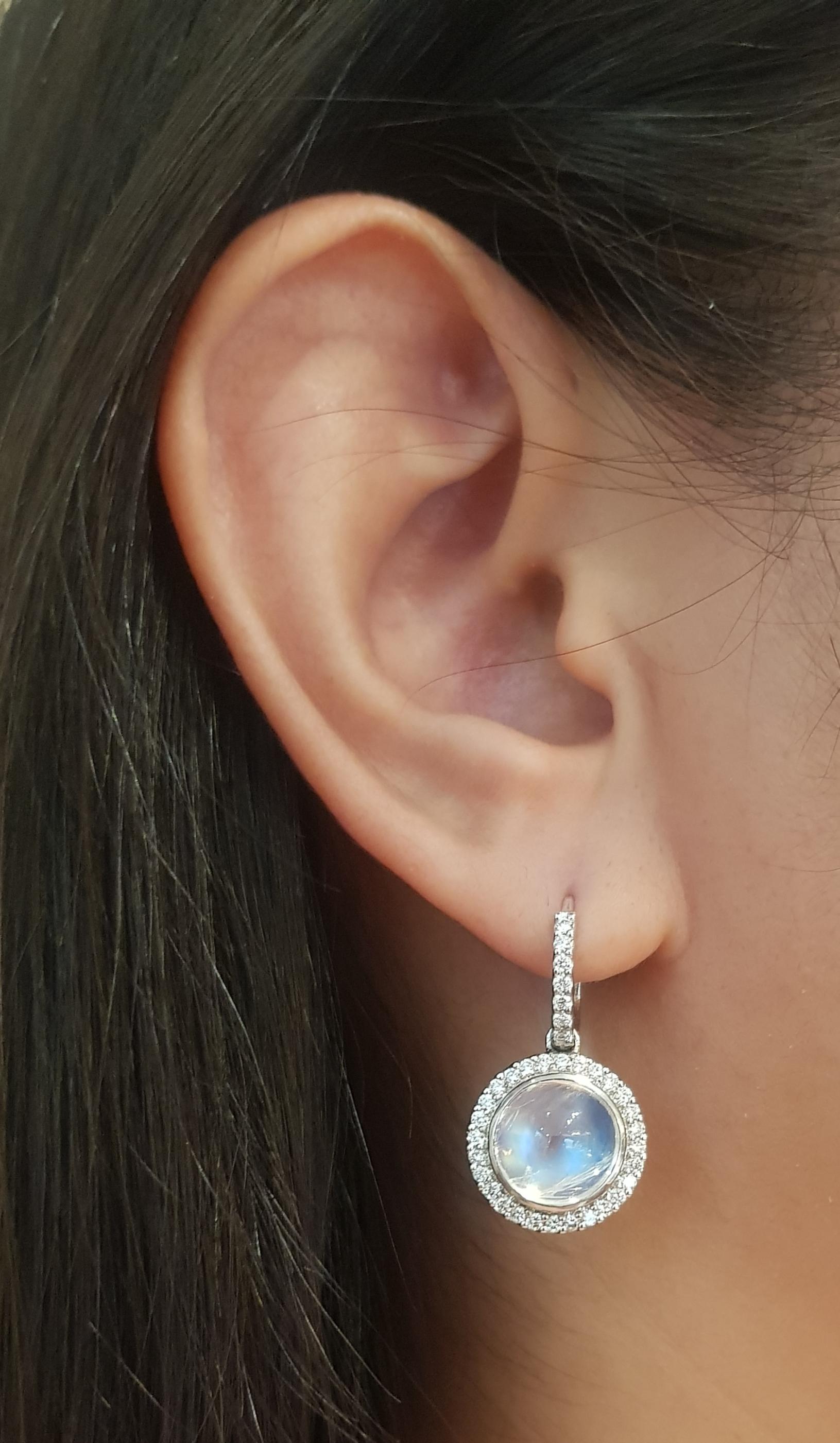Moonstone 9.06 carats with Diamond 0.75 carat Earrings set in 18K White Gold Settings

Width: 1.4 cm 
Length: 2.5 cm
Total Weight: 9.73 grams

