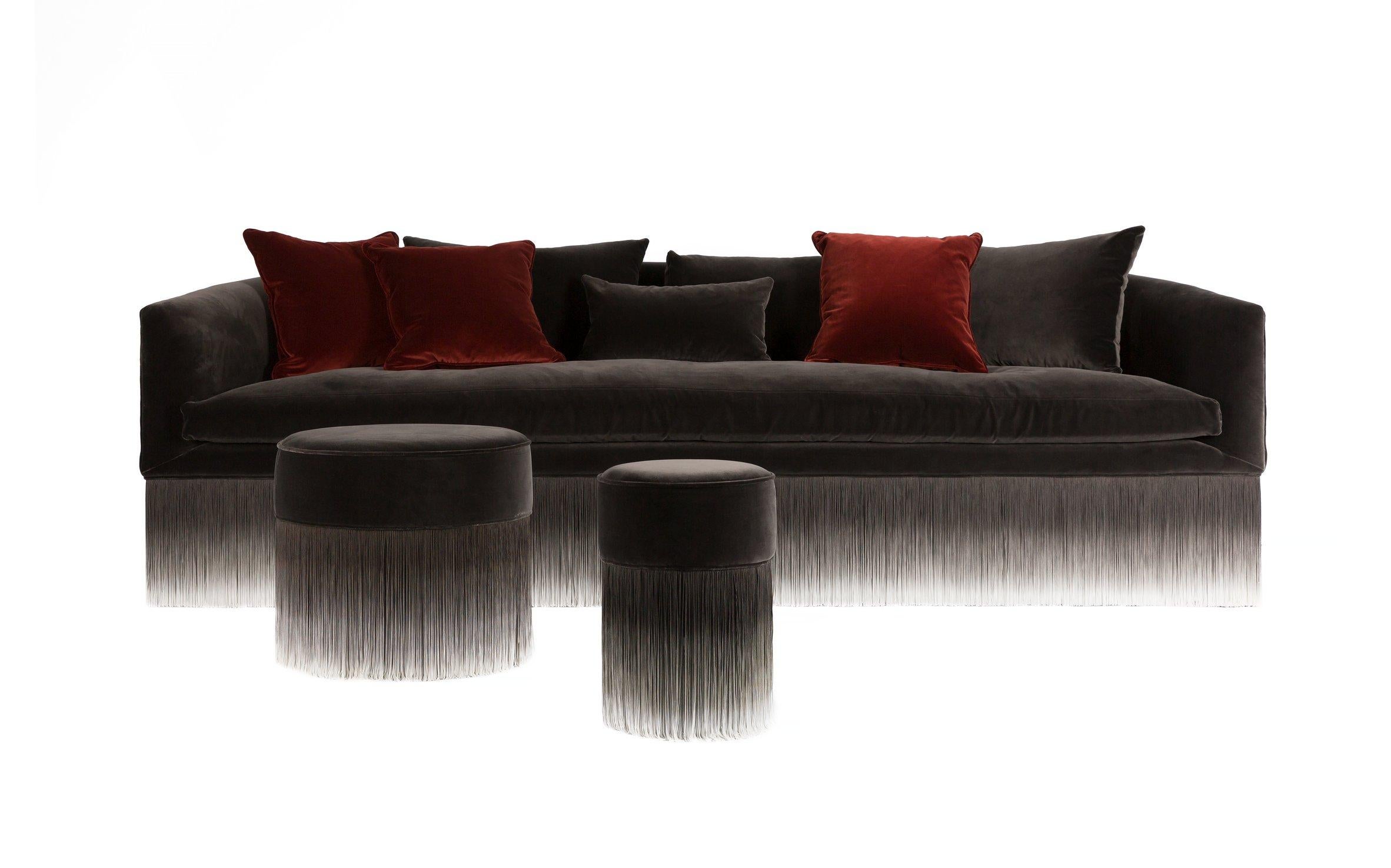 The Amami poufs are simply irresistable and available in three sizes. Dressed in heart-warming velvet, softly floating on long sensuous fringes that decorate and enhance it, producing a fresh breeze of lightness all around the room. Wooden frame,