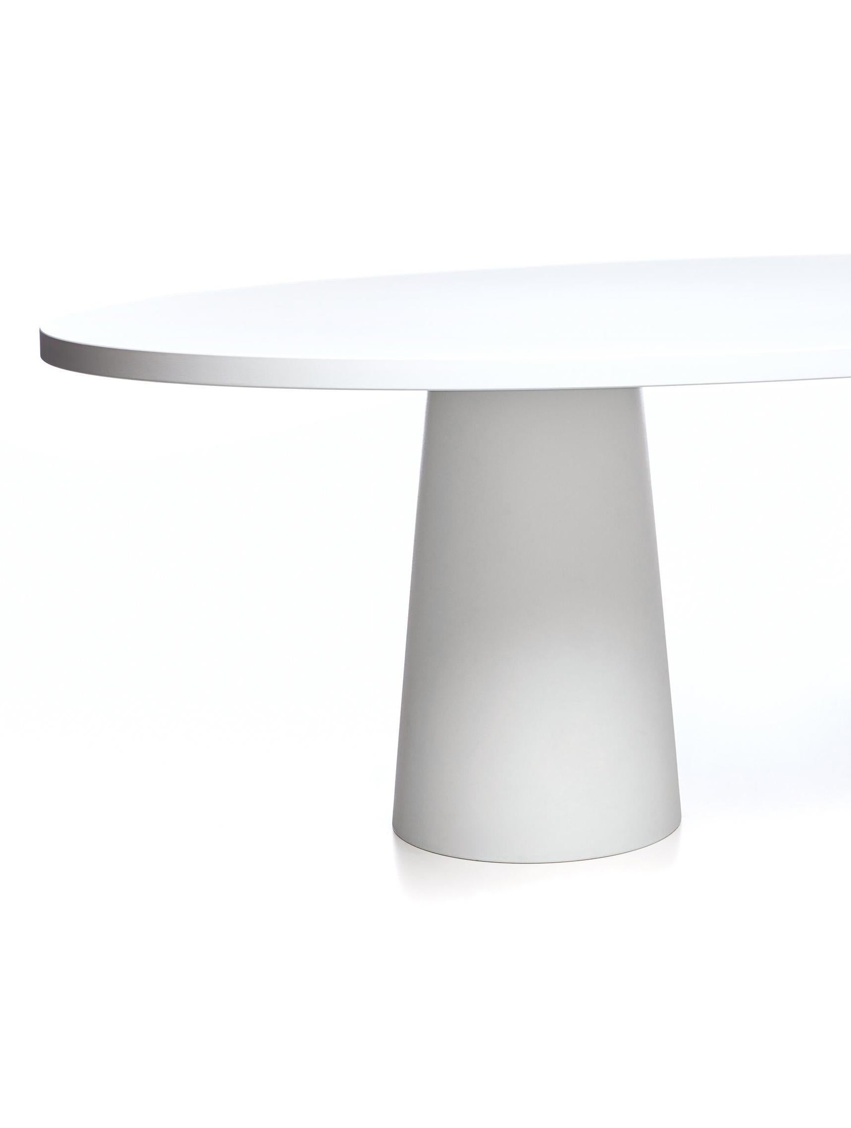 Moooi container dining table with oval top and base in white by Marcel Wanders. White laquered wood top; white Classic base.

The feet must be filled with sand to create extra stability. 

Size: 210 x 135 x 71 H.
 