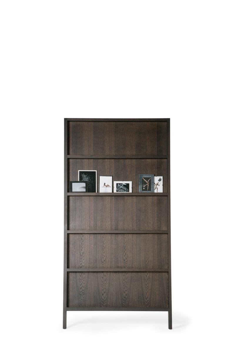 Oblique is a cupboard slash a wall shelf. Make this the mood board of your lifestyle. Display all your favorite publications, company magazines, booklets, guides or photos in the chicest way possible. Stained solid oak, lacquered