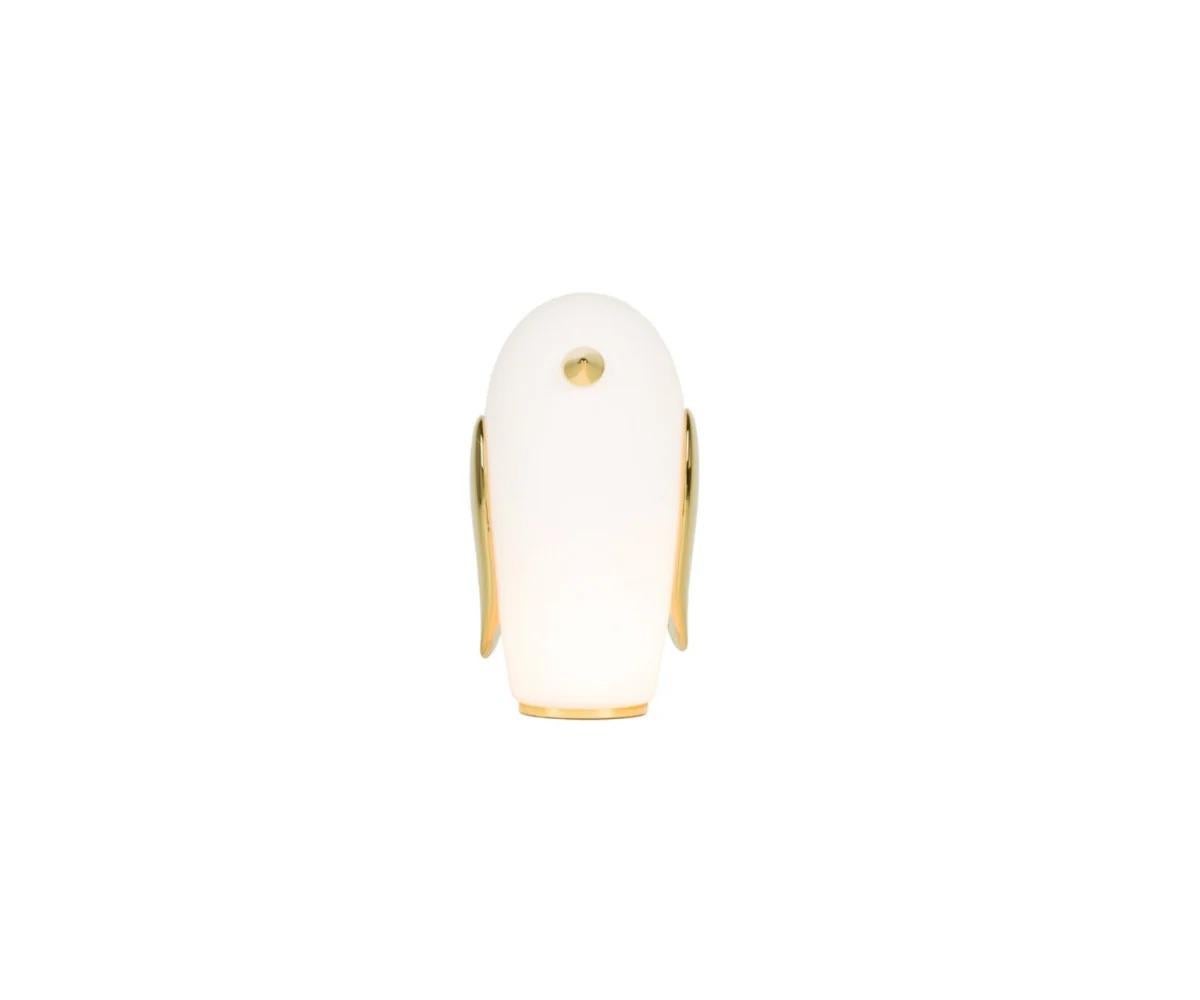 Note: Price Per Light

The Pet Lights collection showcases whimsical yet elegant table lamps featuring the charming characters Uhuh, Purr, and Noot Noot. The lamps, made from frosted glass, emit a warm glow with gold-plated ceramic details and