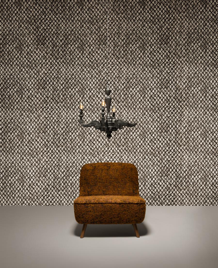 Furniture finished with fire. The beauty and character of burned wood is now captured in a long lasting material. By creating the strange sensation of a burnt chandelier Maarten Baas interpreted his fascination for the element fire with a