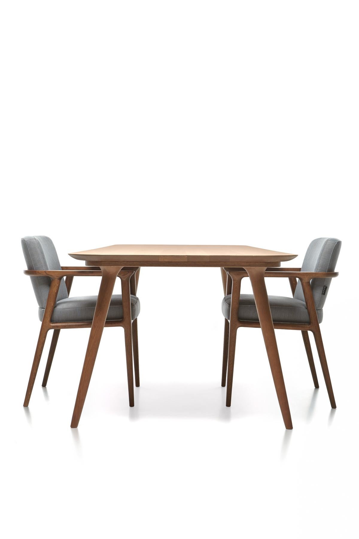 Dining at home acquires a whole new meaning with the classic elegance and contemporary comfort of the Zio dining chair by Marcel Wanders. Sitting in its solid, sculptured wooden structure and soft cushioned body makes you feel immediately at ease,