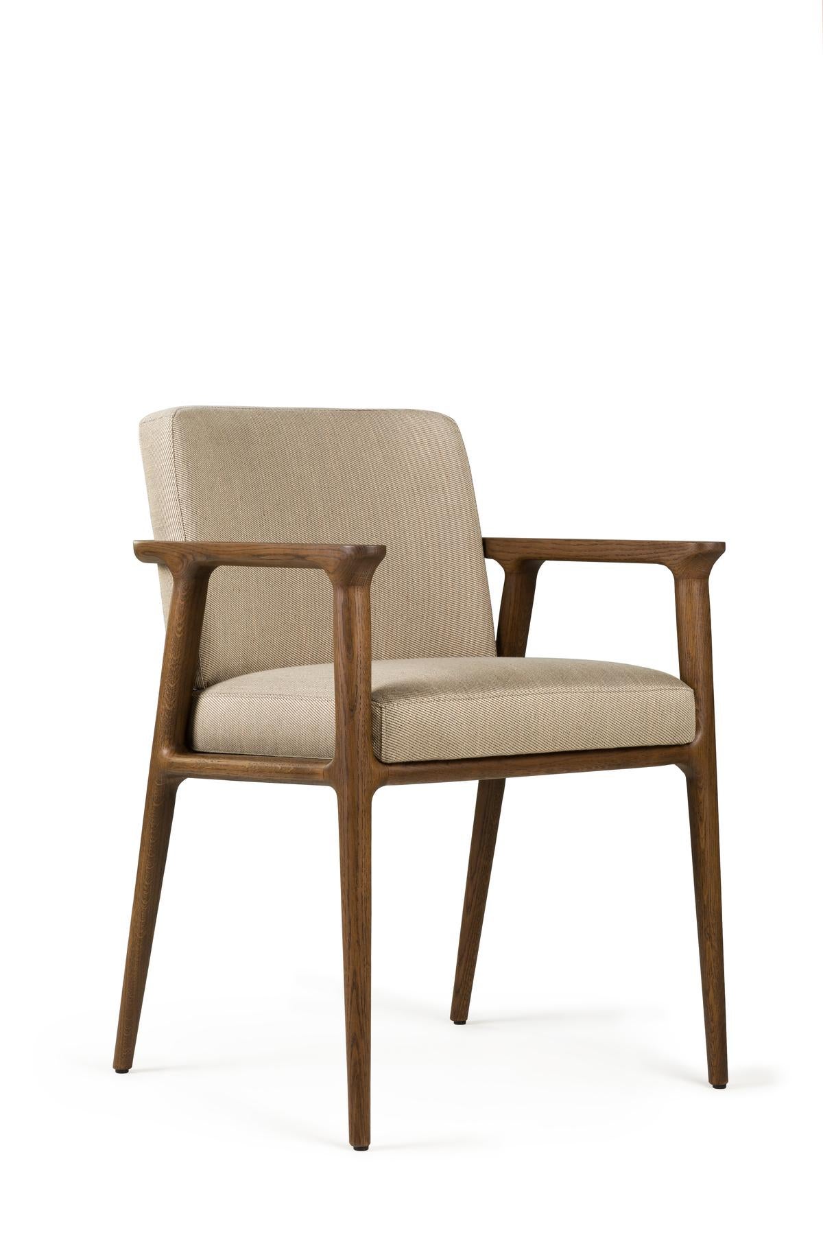 Dining at home acquires a whole new meaning with the classic elegance and contemporary comfort of the Zio dining chair by Marcel Wanders. Sitting in its solid, sculptured wooden structure and soft cushioned body makes you feel immediately at ease,