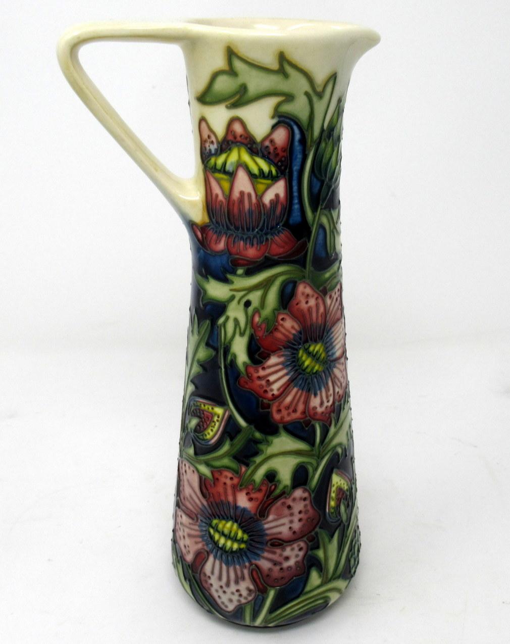 Superb hand painted Art Pottery Moorcroft Large Ewer of traditional outline with single “V” shaped handle. Made in stoke-in-trent, England. Decorated in the “Pheasants Eye” Pattern by premier Moorcroft Artist Shirley Hayes. 

The outer body with