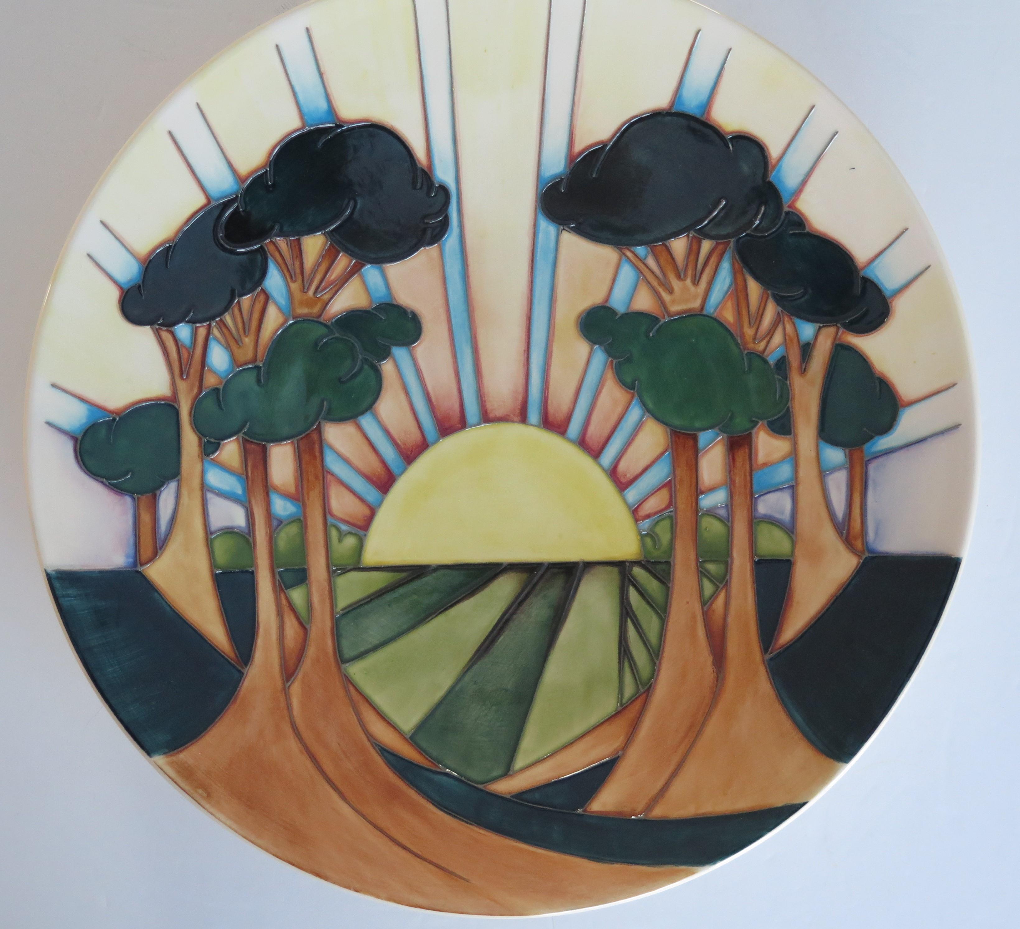 This is a very good example of a large plate or dish made by Moorcroft Pottery as a Trial piece in 2017.

The pattern is known as Daybreak, and was designed by Nicola Slaney as a Trial piece in 18/7/2107

The piece is fully marked to the base