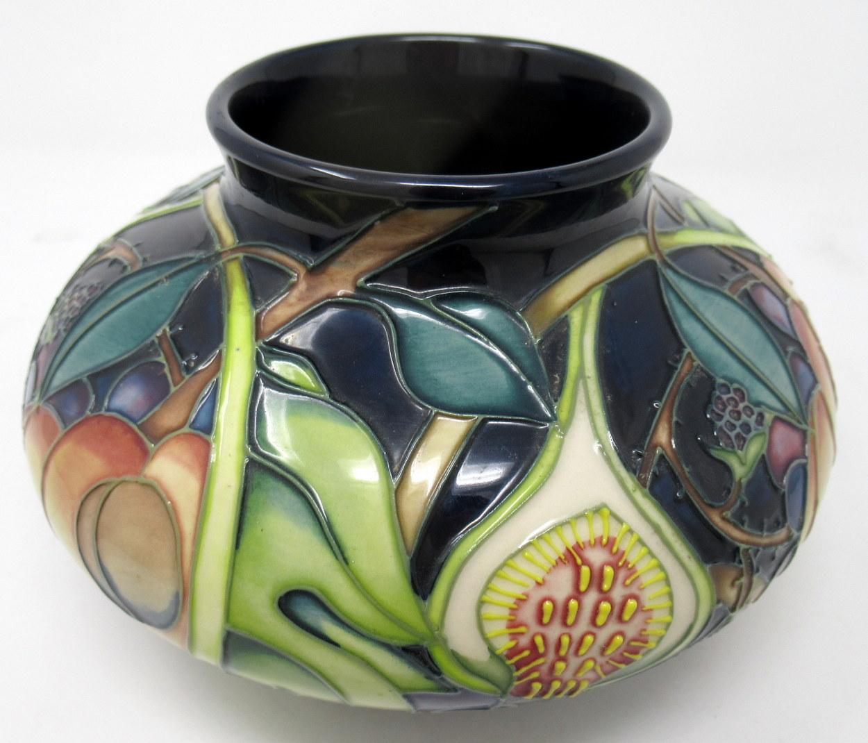 Superb hand painted art pottery moorcroft large squat flower vase of typical bulbous outline. Made in stoke-in-trent, England. Decorated in the Queens Pattern by premier Moorcroft Artist Emma Bossons FRSA. 

Queens Choice with its succulent