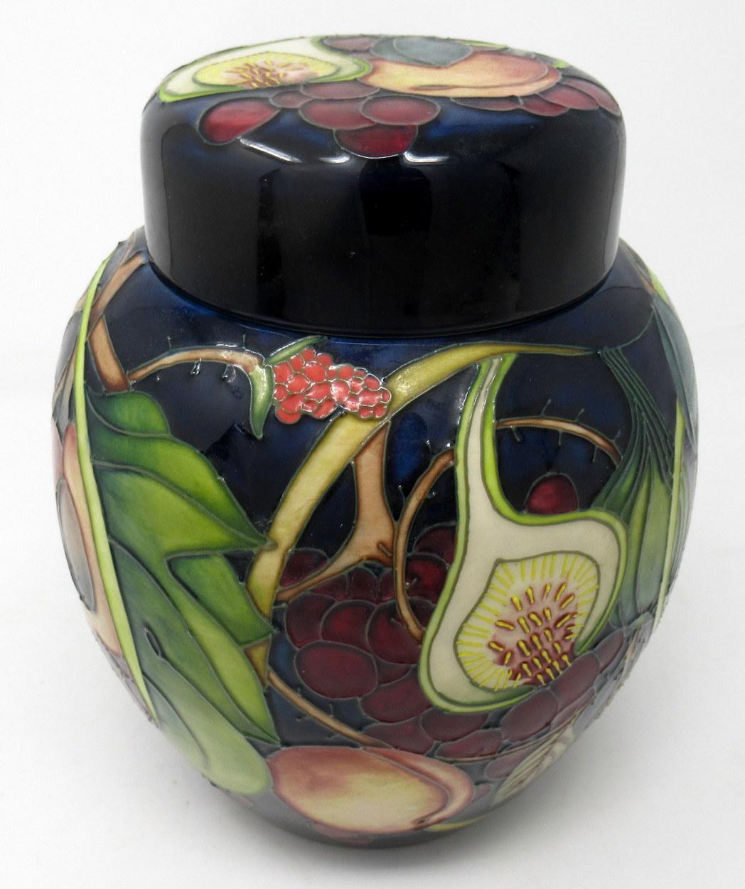 Superb hand painted Art Pottery Moorcroft large ginger jar and original cover of typical bulbous outline. Made in Stoke-in-Trent, England. Decorated in the Queens Pattern by premier Moorcroft Artist Emma Bossons FRSA.

Queens Choice with its