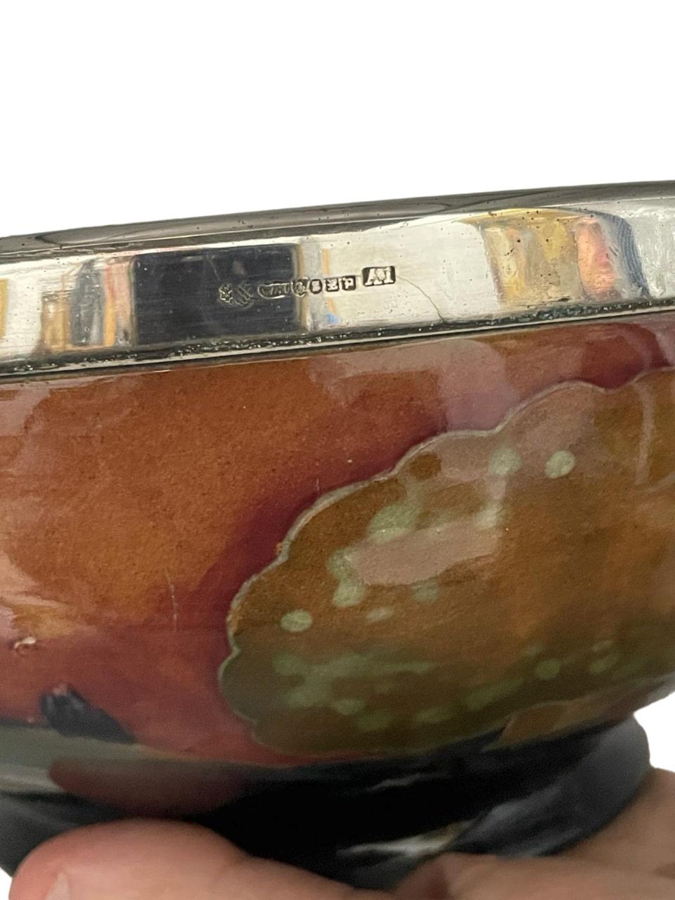 A superb large early Moorcroft Bowl, decorated in the rare Eventide pattern with William Hutton & Sons silver overlay.Glazed earthenware, electroplate
Cross-arrows and marks for William Hutton & Sons electroplate, impressed and painted marks for