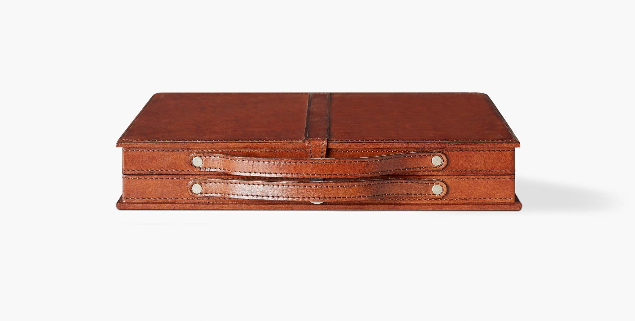 Our Moore Backgammon Set is crafted in genuine leather and lined in smooth velvet, featuring leather inserts and weighted playing pieces. Our handcrafted fabrics, leathers, and finishes are inspired by the natural variations within fibers, textures,
