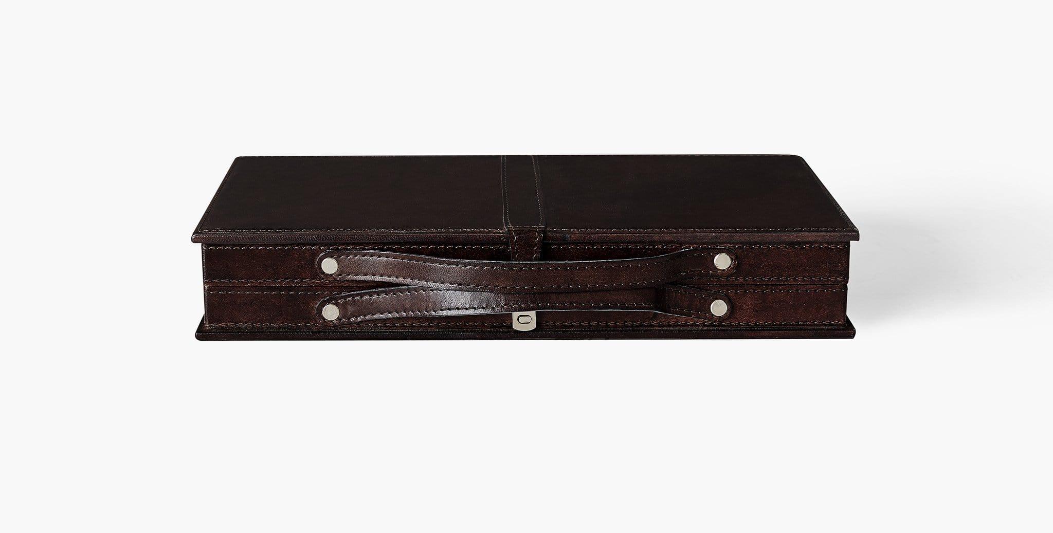 Our Moore Backgammon Set is crafted in genuine leather and lined in smooth velvet, featuring leather inserts and weighted playing pieces. Our handcrafted fabrics, leathers, and finishes are inspired by the natural variations within fibers, textures,