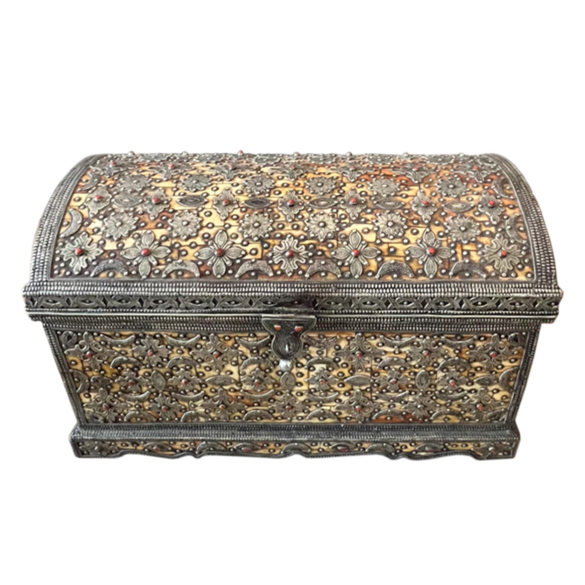 This trunk has been beautifully decorated using agate and silver on a layer of bone. It has a lovely latch - please take a look at all the pictures to see the intricate detail and leather lining inside. 

Made in Morocco in the 1960s. 

Very