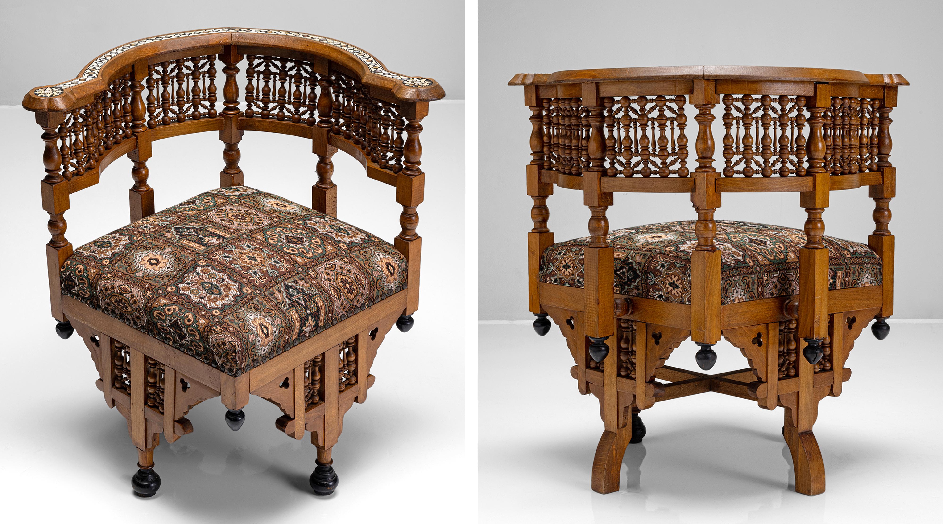 Moorish armchair

Syria, Circa 1950

Fruitwood frames with Intricate fretwork on the backend side with celluloid inlay. Original upholstery.