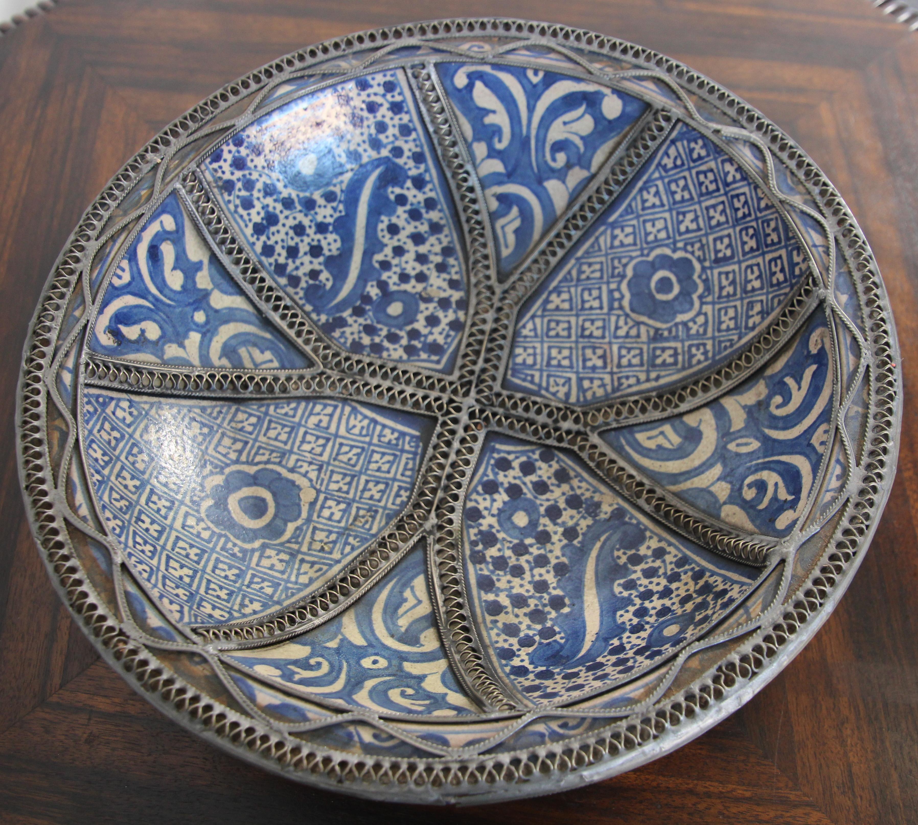 Handcrafted Moorish Moroccan Bleu de Fez decorative ceramic Bowl, dish. 
Ceramic bowl in Bleu de Fez, very nice designs hand painted by artist in Fez.
Geometrical and floral Moorish designs and adorned with nickel silver filigree designs.
Glazed