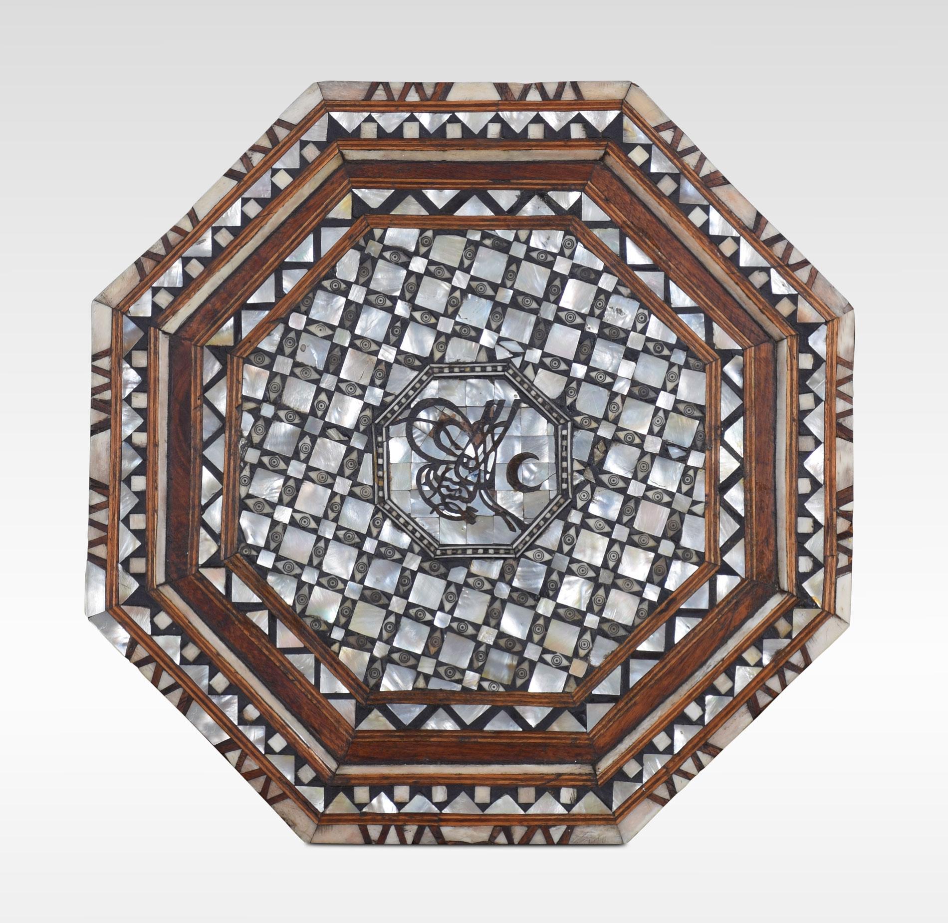 Moorish bone and mother of pearl inlaid hardwood occasional table, the octagonal top above a conforming stand with a geometric design, inlaid throughout with mother of pearl and bone.

Dimensions:
Height 20 inches
Length 18 inches
Width 18