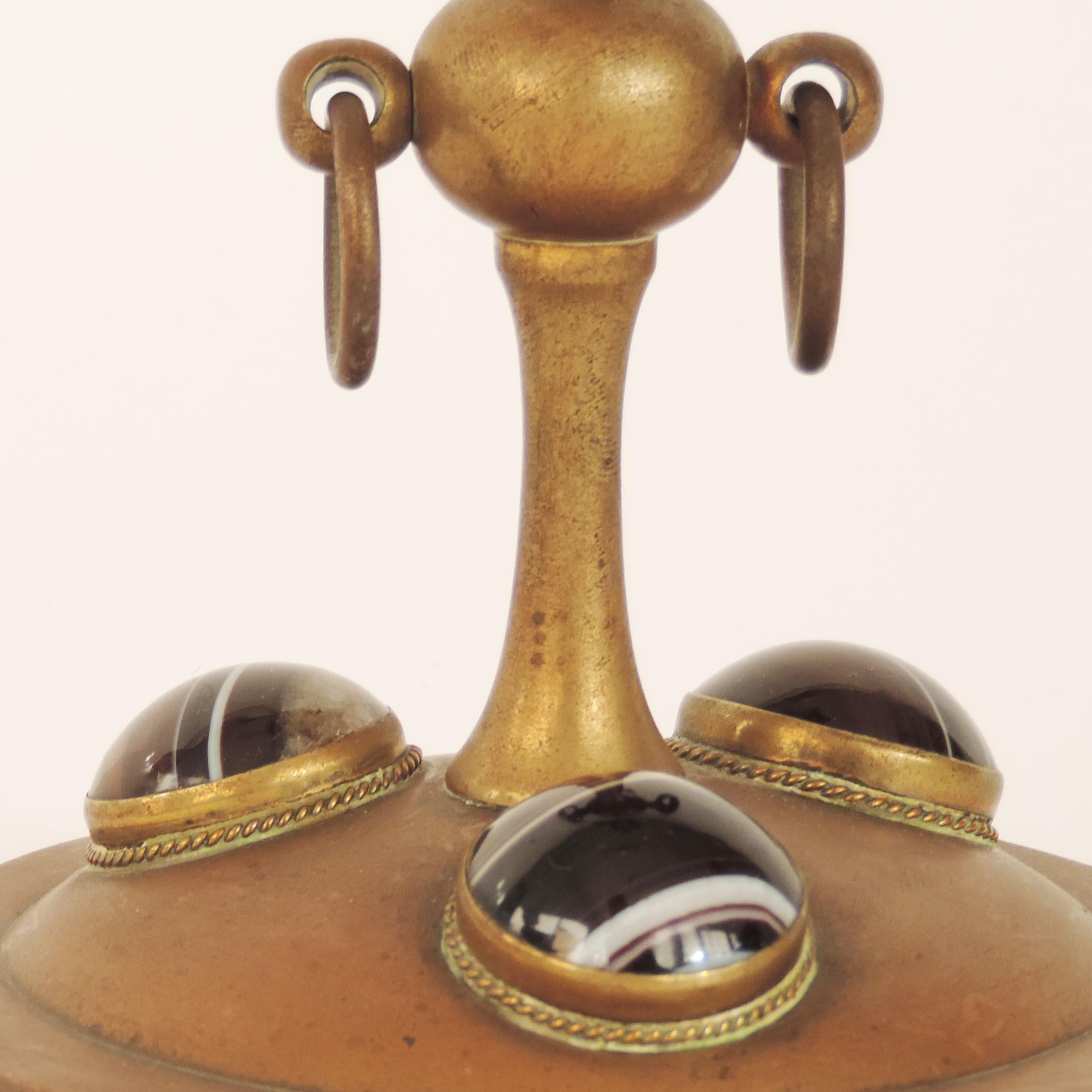 Candlestick in brass and hardstones attributed to Tiffany, USA, 1920s.