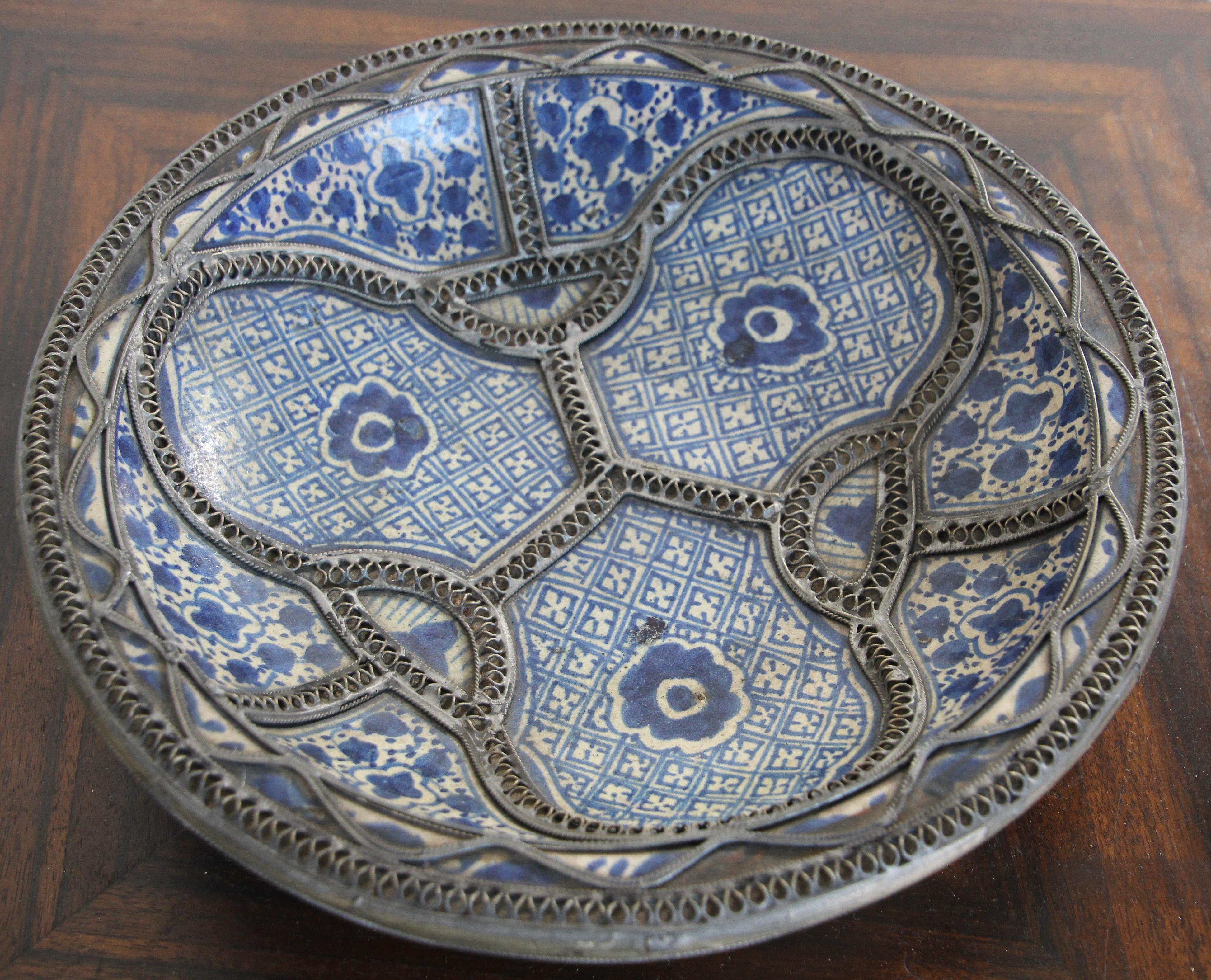 Handcrafted Moorish Moroccan polychrome decorative ceramic Bowl, dish from Fez. 
Bleu de Fez, very nice designs hand painted by artist in Fez.
Geometrical and floral Moorish designs and adorned with nickel silver filigree designs.
Glazed