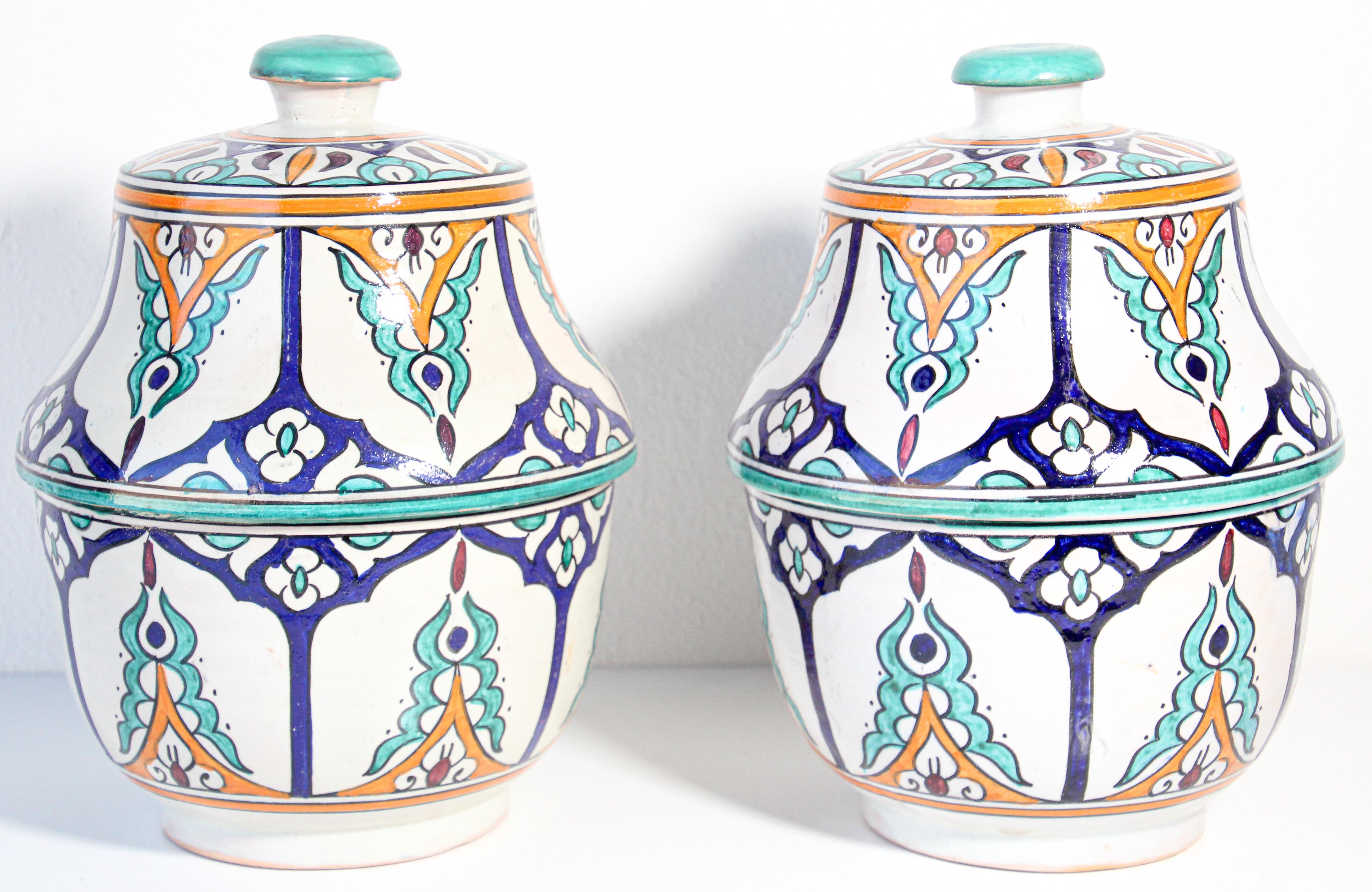 Large pair of Moroccan glazed polychrome ceramic jars tureen with cover.
Hand painted ceramic Jubbana, handcrafted by skilled Moroccan artisans in Fez Morocco.
Moorish designs in turquoise, cobalt blue, teal, saffron yellow, prune and ivory
